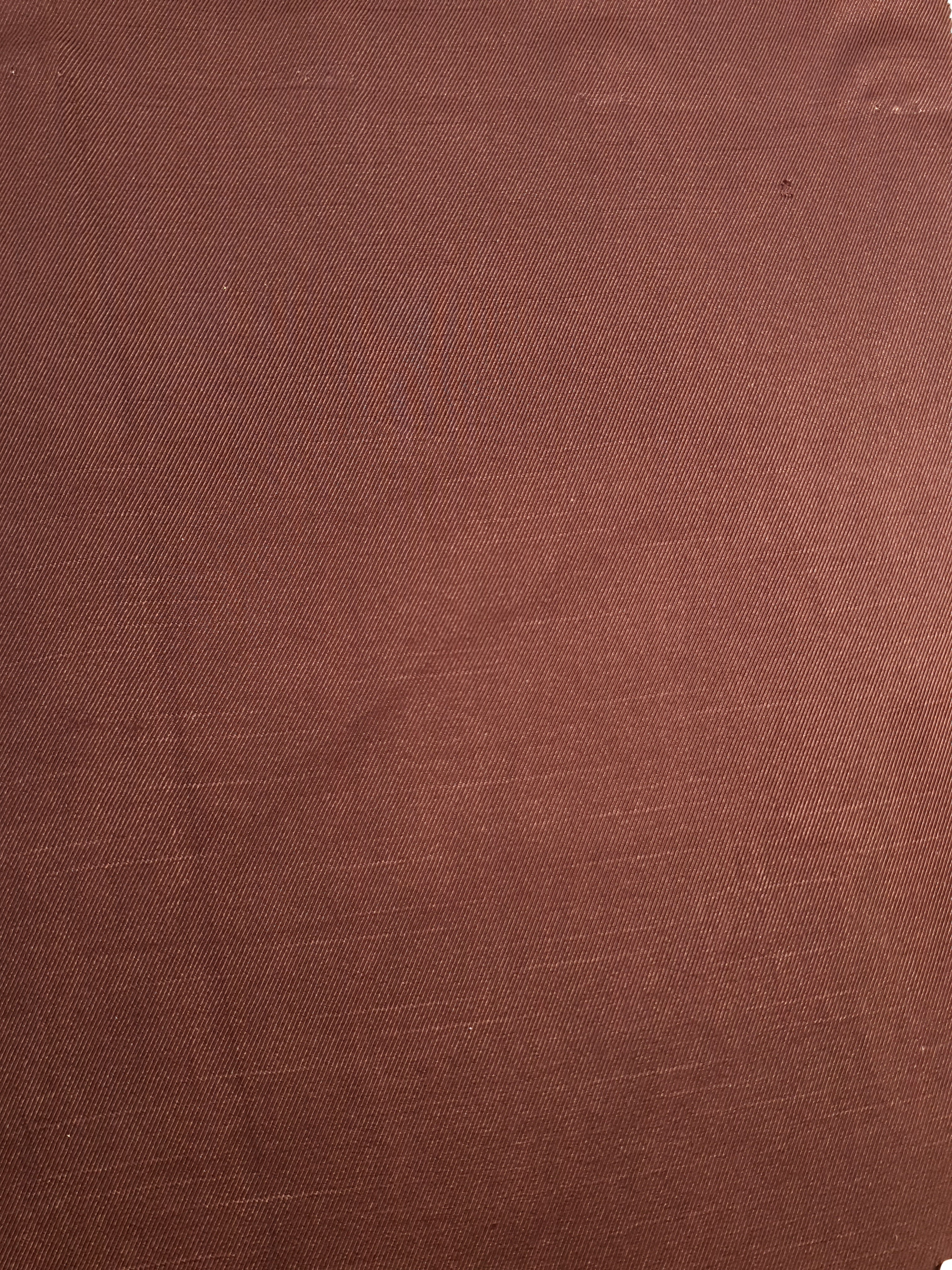 Full view of flat motif rayon jacquard fabric for dressmaking.