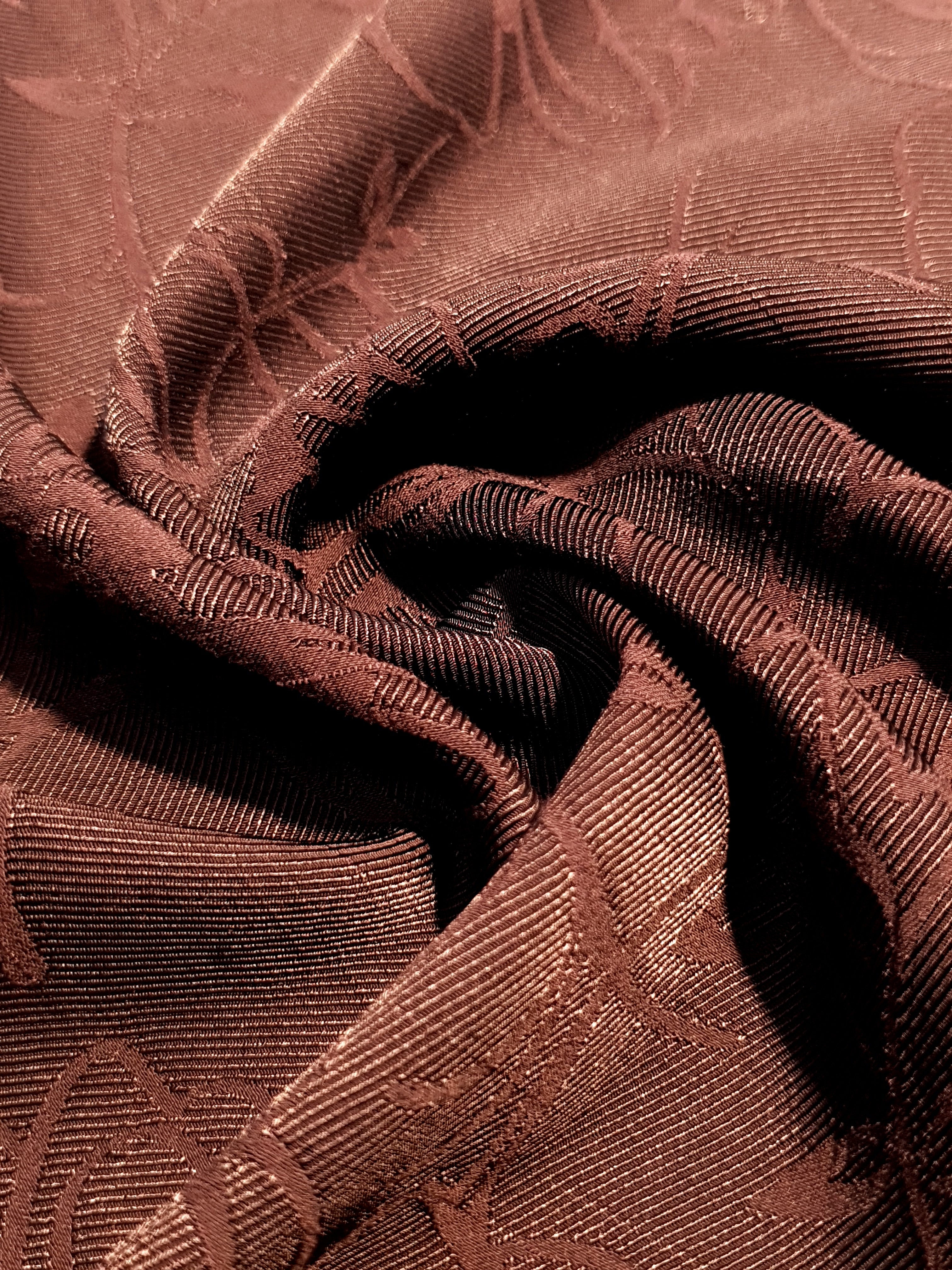 Drape detail of floral rayon jacquard fabric.