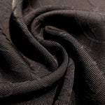 Drape detail of structured floral rayon jacquard for blouses.