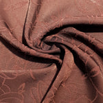 Draped floral rayon jacquard for dresses and layers.