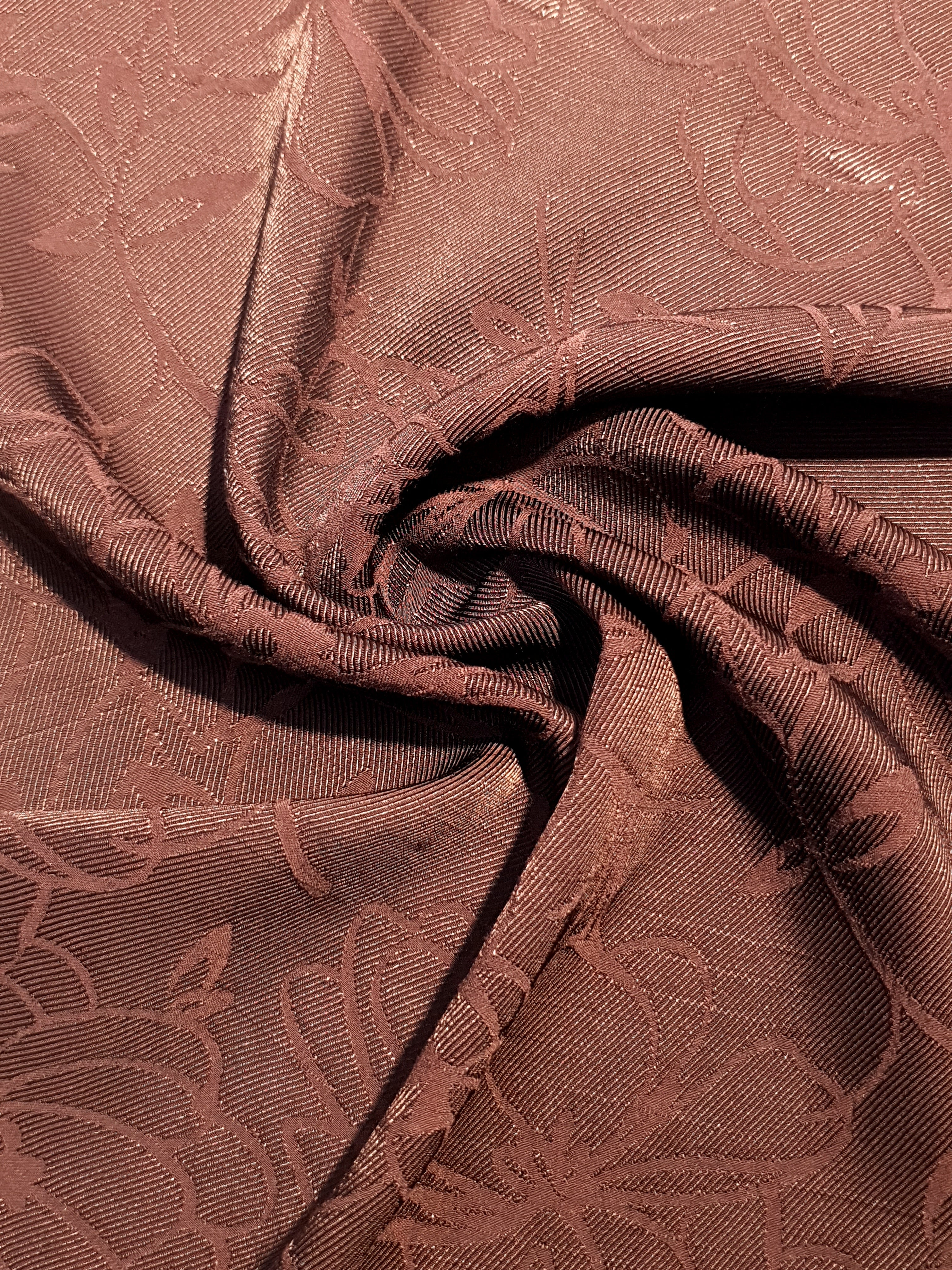 Draped floral rayon jacquard for dresses and layers.