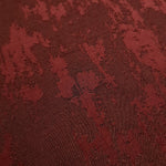 Close detail of matrix motif rayon jacquard with crisp woven pattern.