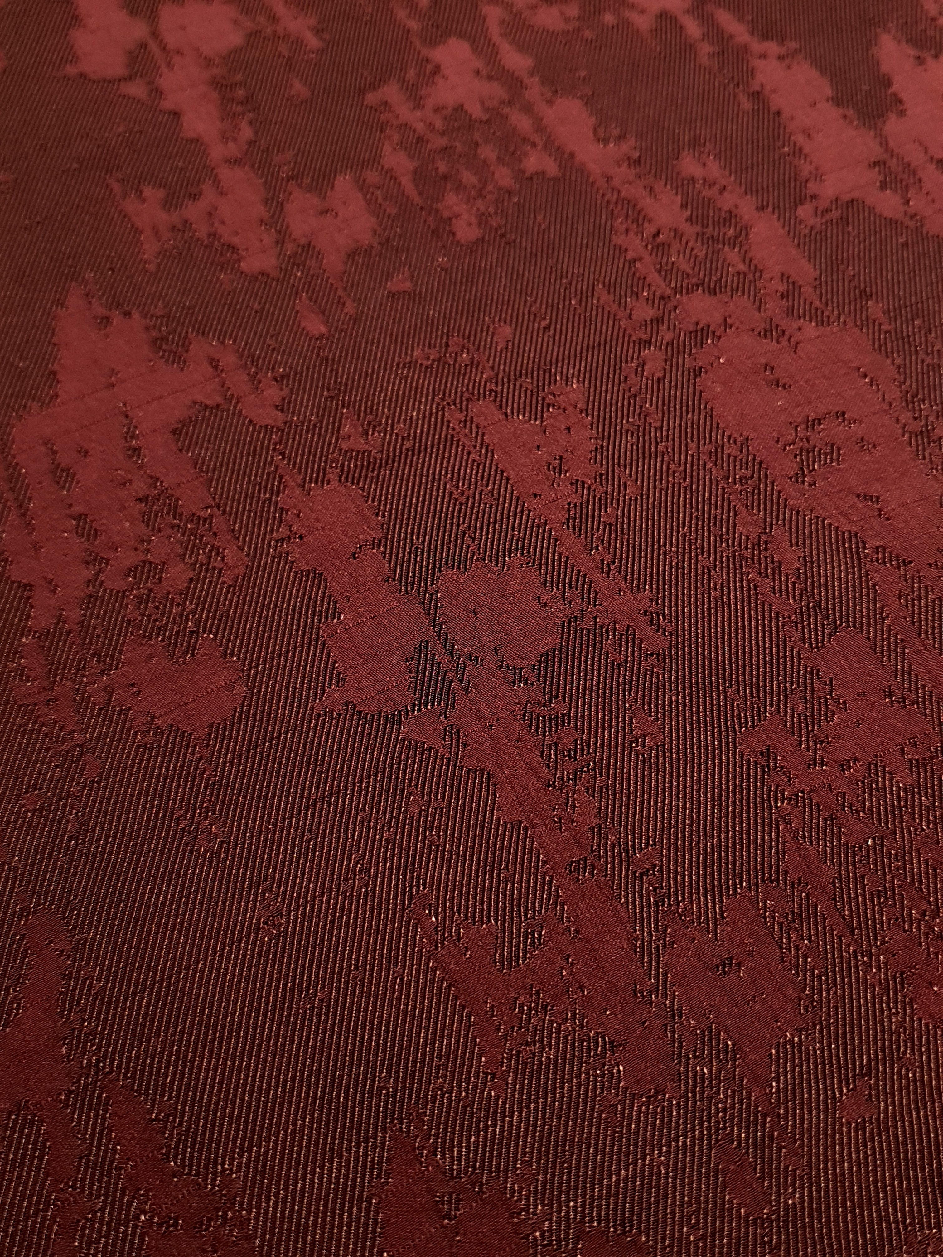 Close detail of matrix motif rayon jacquard with crisp woven pattern.