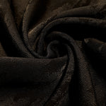 Drape detail of matrix rayon viscose jacquard for dresses and layers.