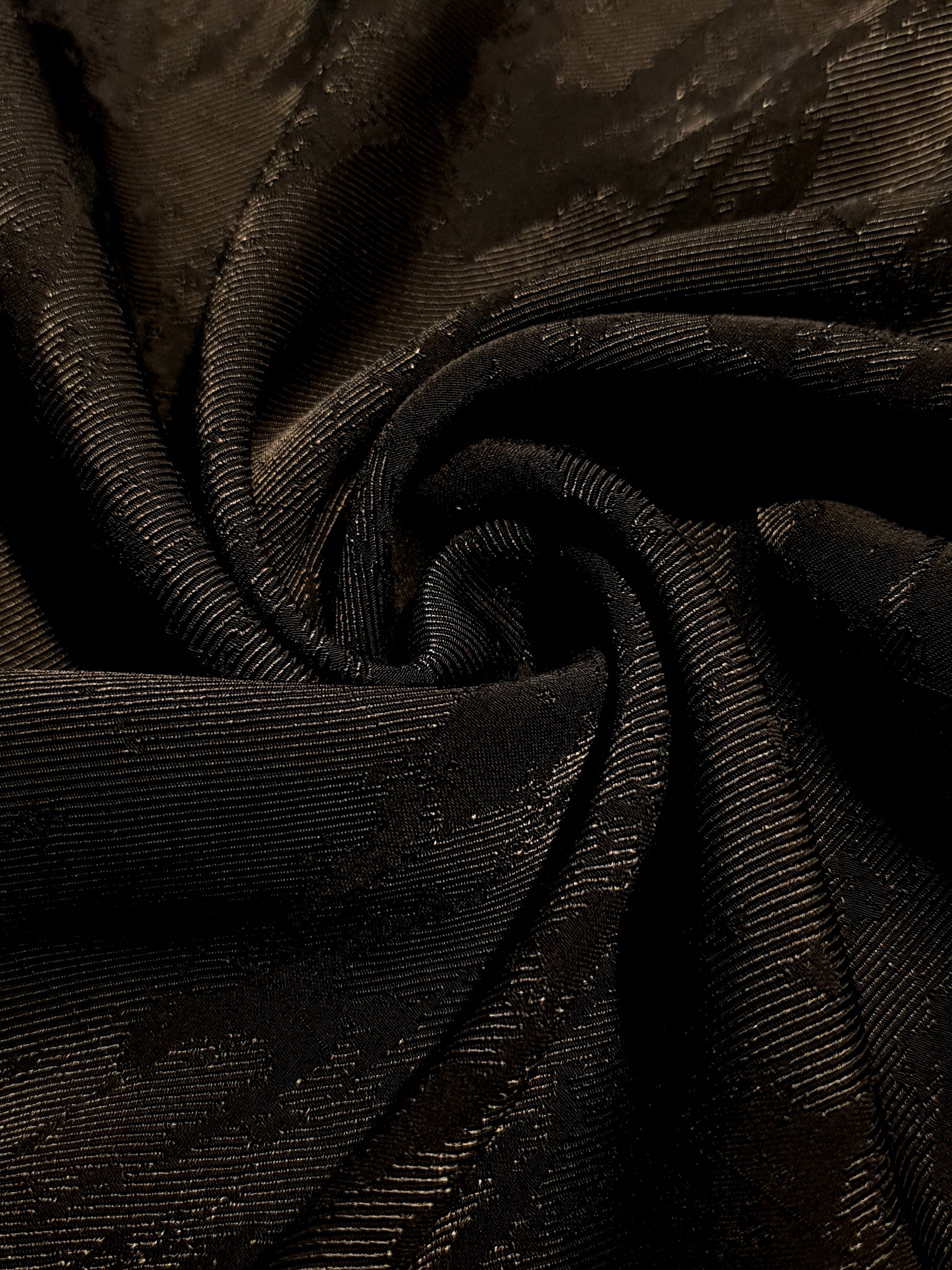 Drape detail of matrix rayon viscose jacquard for dresses and layers.