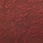 Close detail of pansy flower rayon jacquard with woven motif.