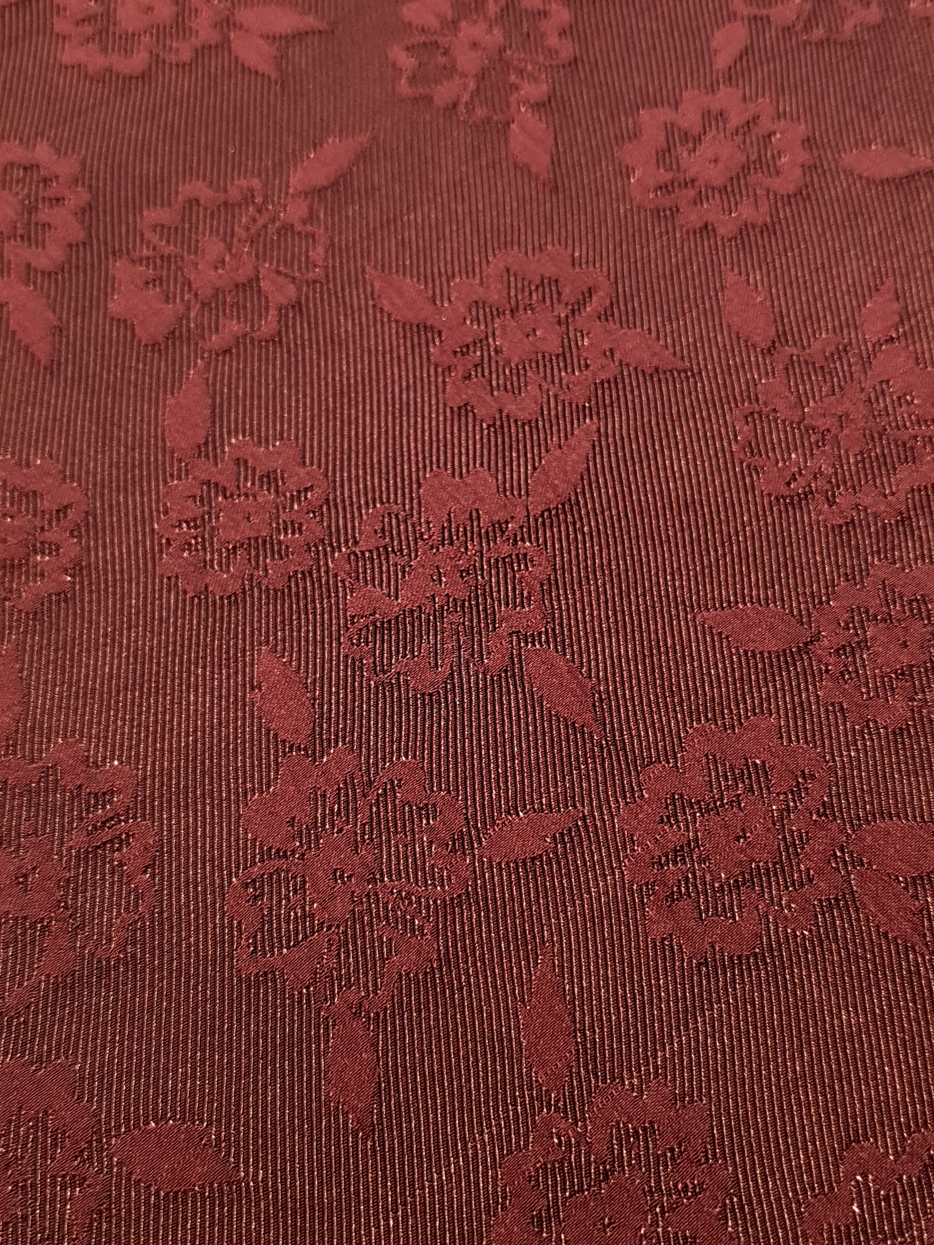 Close detail of pansy flower rayon jacquard with woven motif.