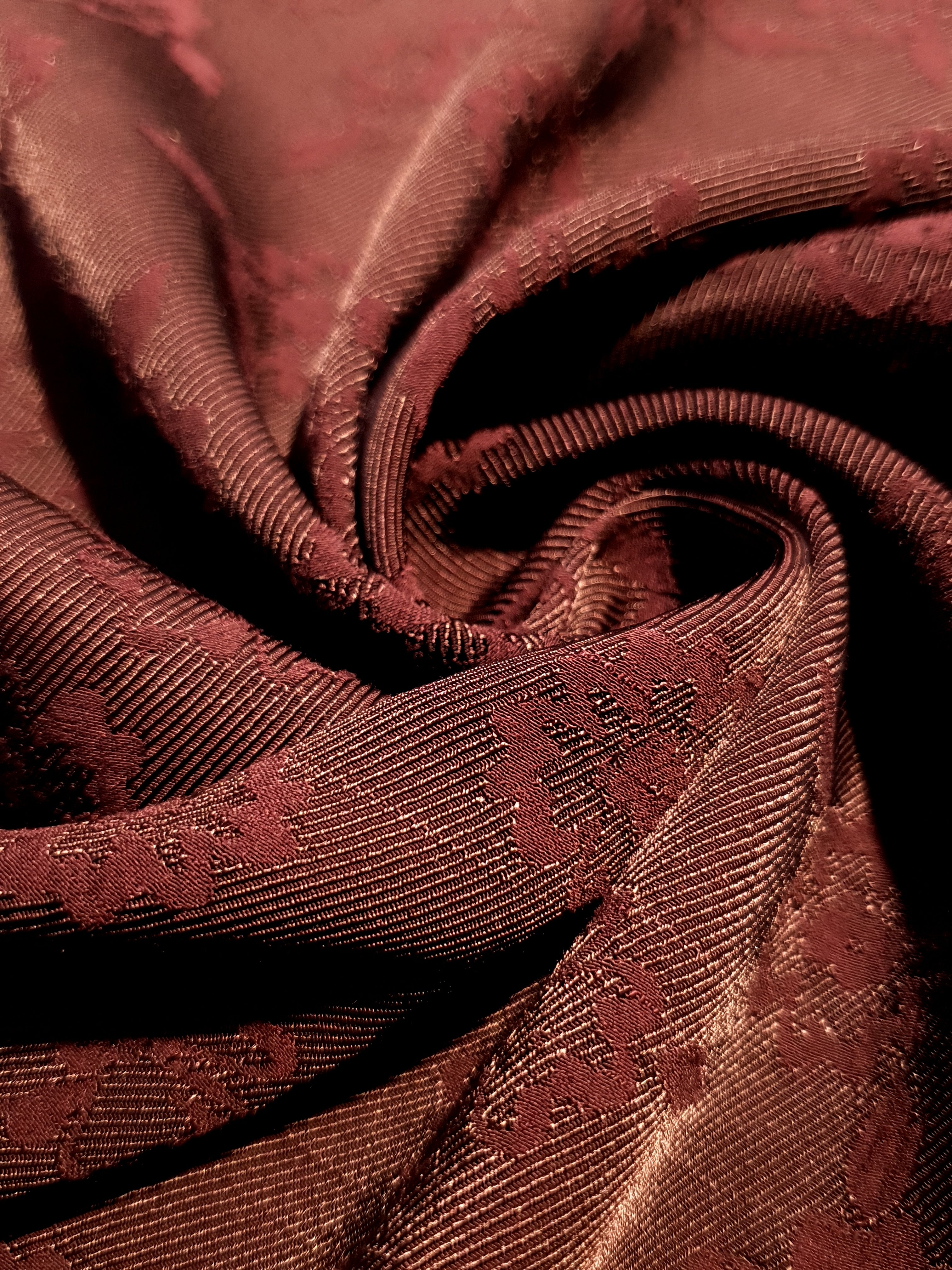 Drape detail of pansy flower rayon jacquard for dresses and layers.
