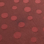 Close detail of polka dot rayon jacquard with woven surface.