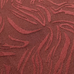 Close detail of seaweed motif rayon jacquard with raised woven pattern.