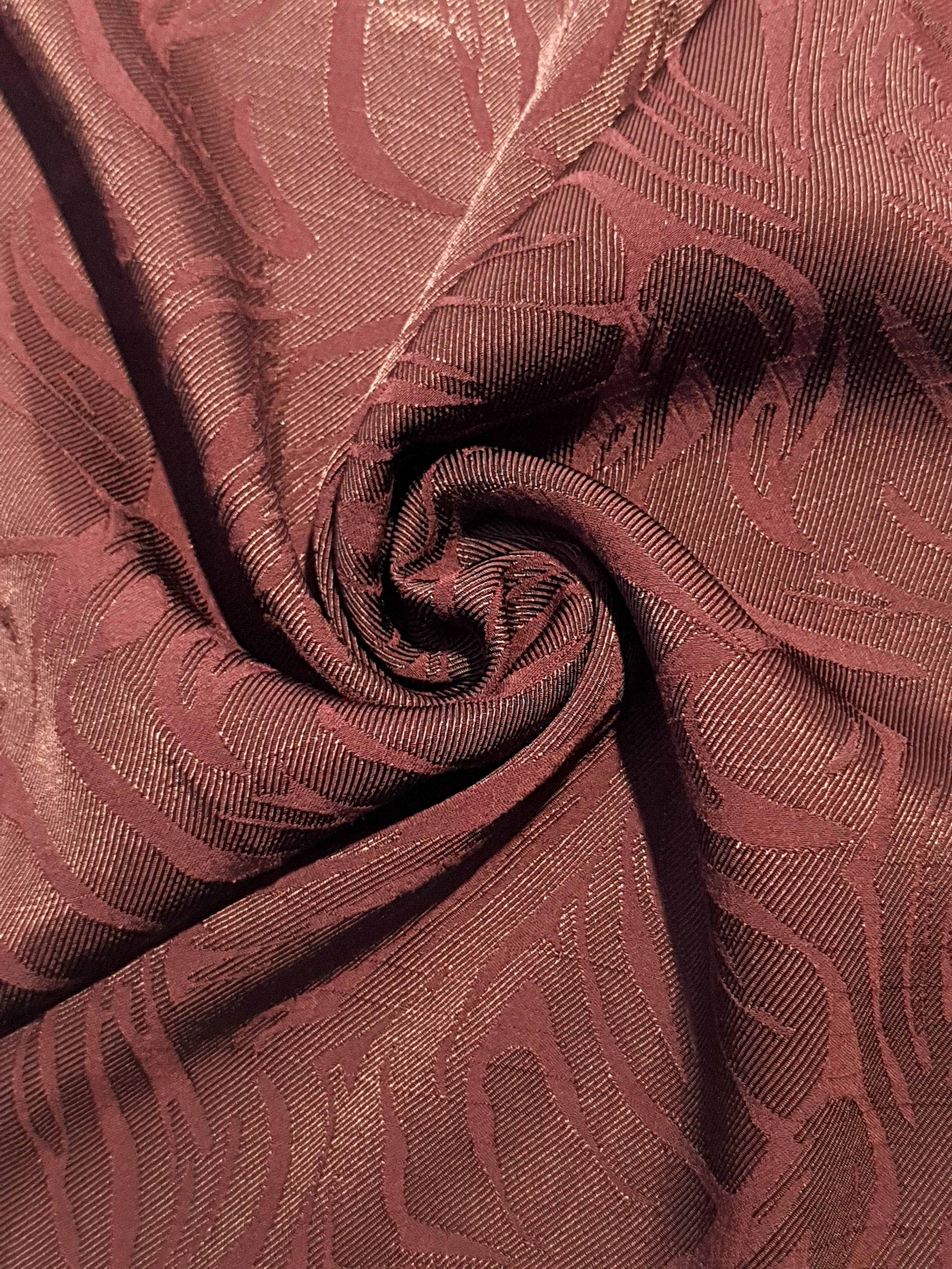 Seaweed motif rayon jacquard drape view with structured garment flow.