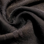 Drape detail of structured swirl jacquard for tailored layers.