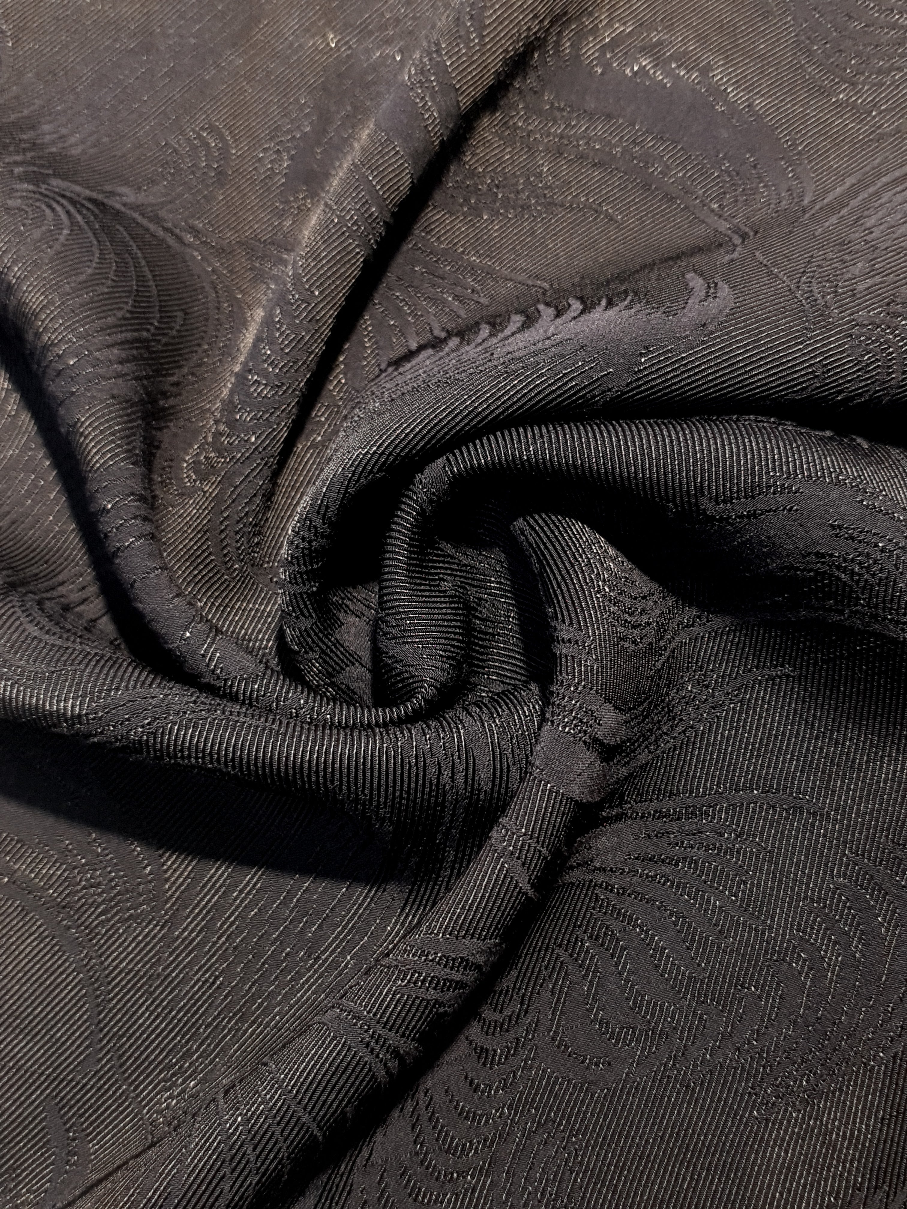 Structured swirl rayon jacquard drape view with soft crisp movement.