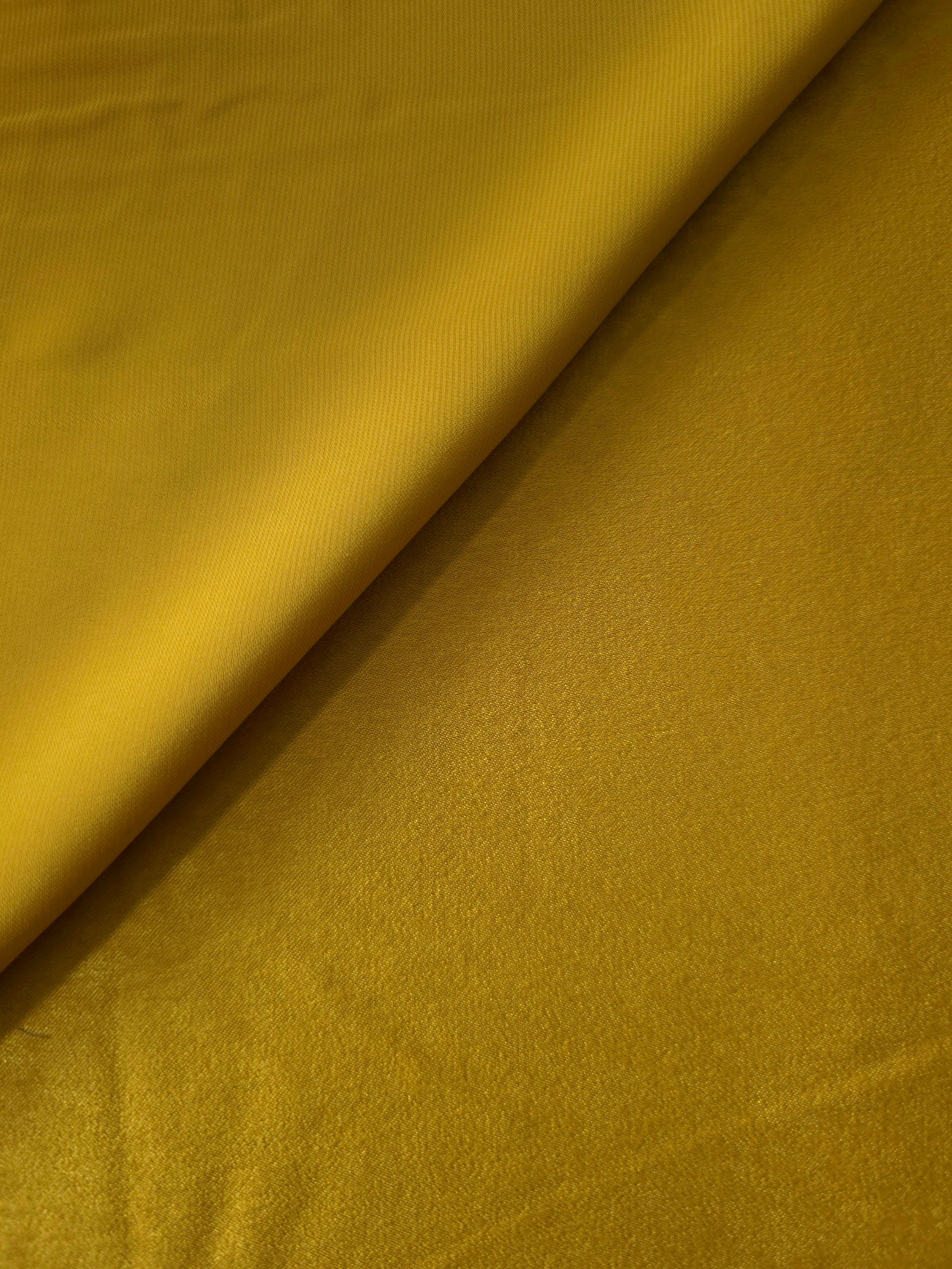 Close-up texture of Mustard Yellow sandwashed silky polyamide fabric