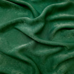 Close-up texture of Emerald Green sandwashed silky polyamide fabric