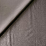 Close-up texture of Smoked Charcoal sandwashed silky polyamide fabric