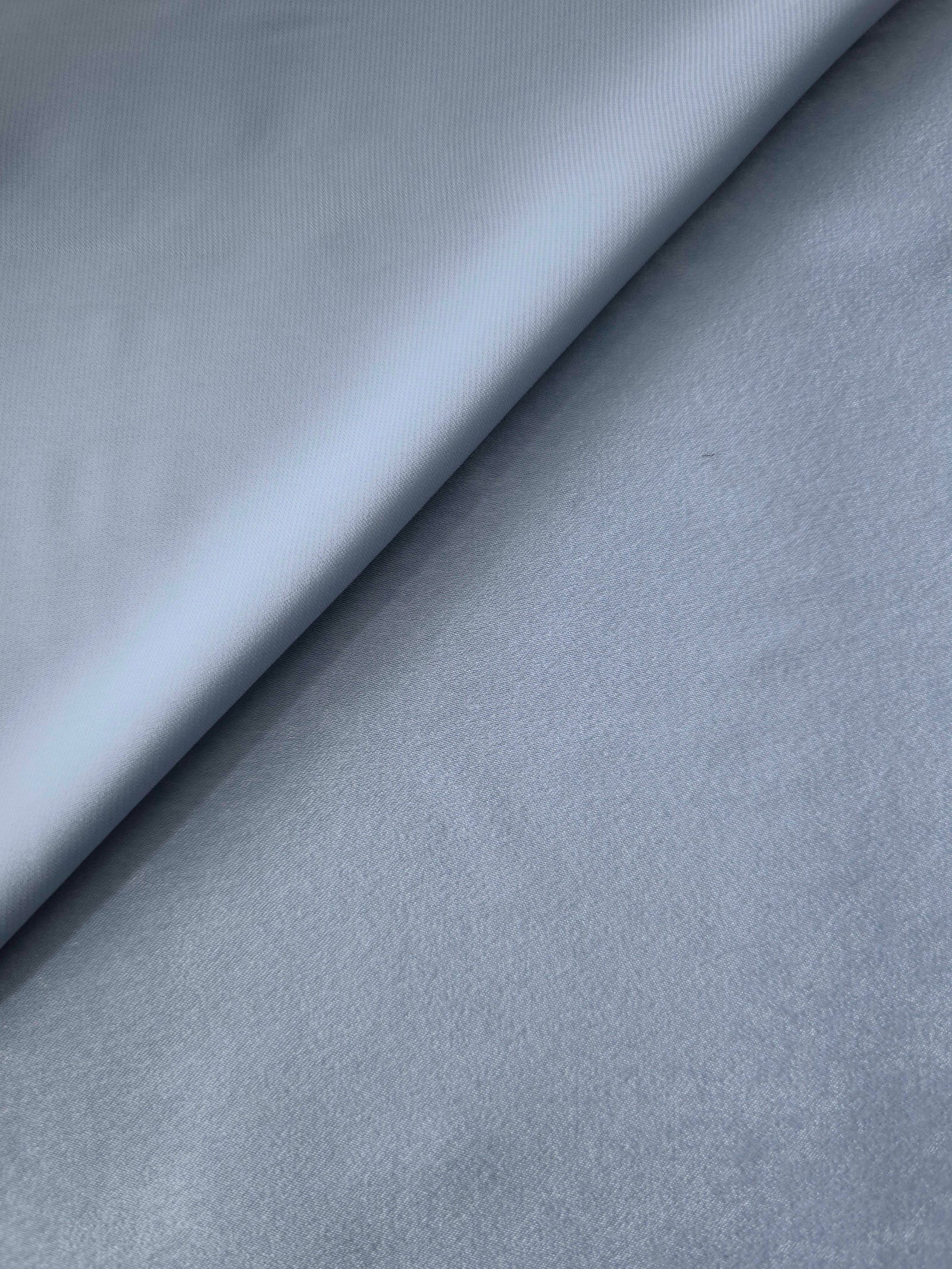 Close-up texture of Silver Blue sandwashed silky polyamide fabric