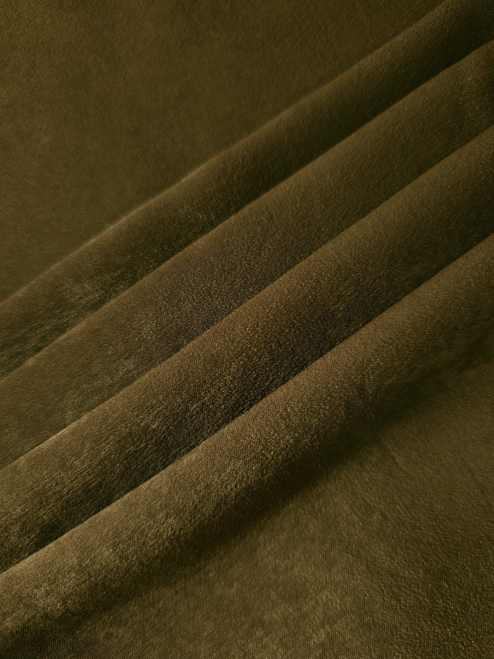 Close-up texture of Dark Khaki sandwashed silky polyamide fabric