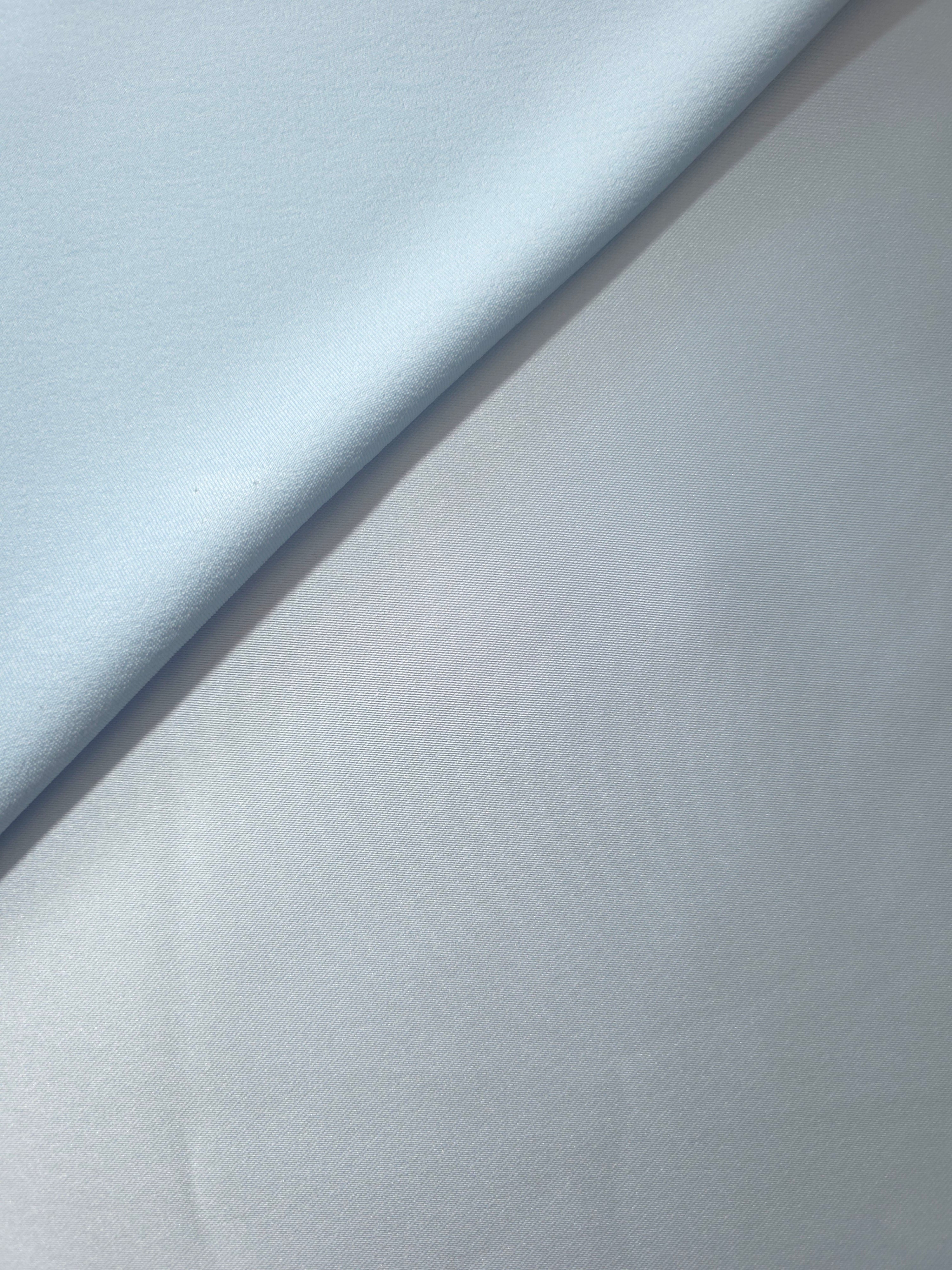 Baby Blue silky satin in folded detail, highlighting gentle sheen and clean body for structured bodice accents, pleated skirts and formal dress panels.