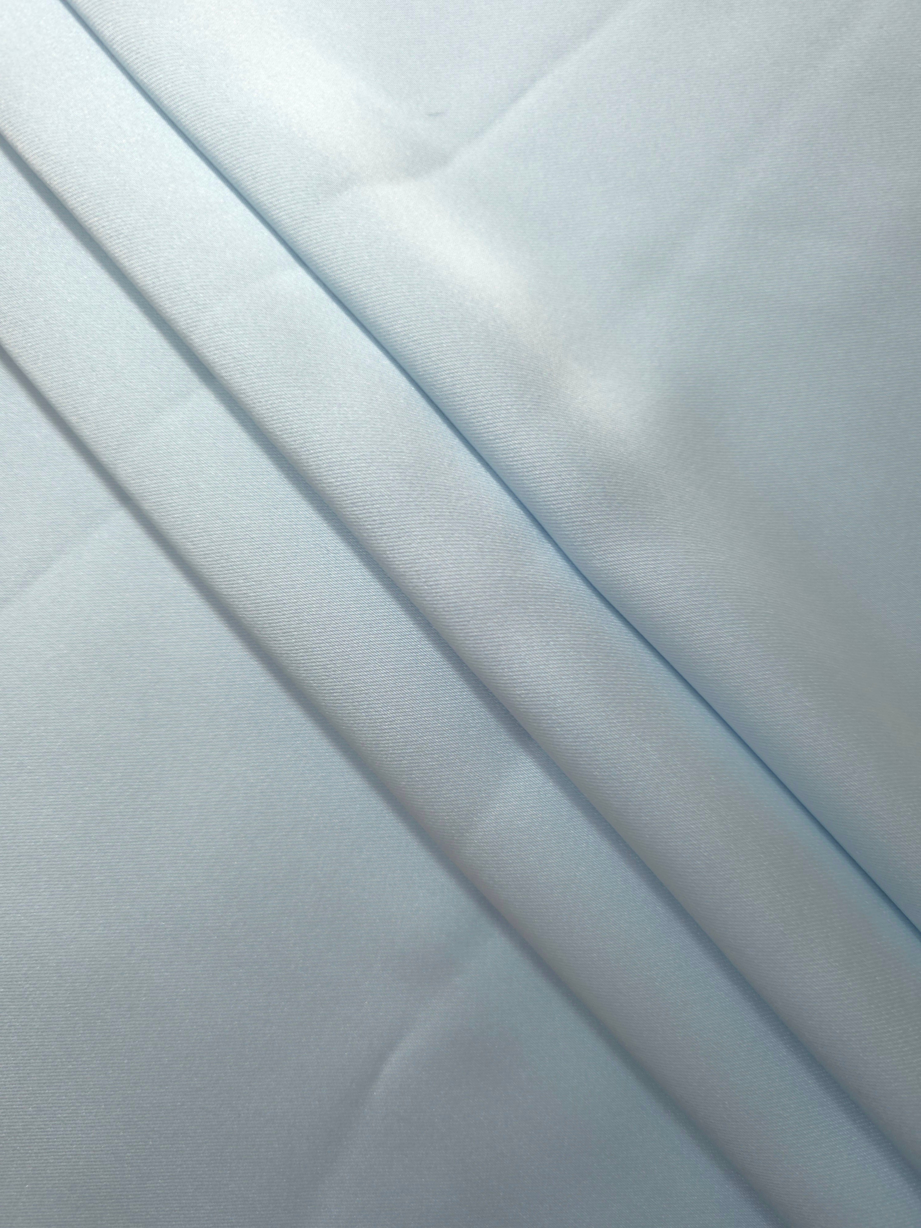 Soft folds of Baby Blue satin reveal a graceful silky drape suited to slip dresses, camisoles and lightweight bridal party robes.