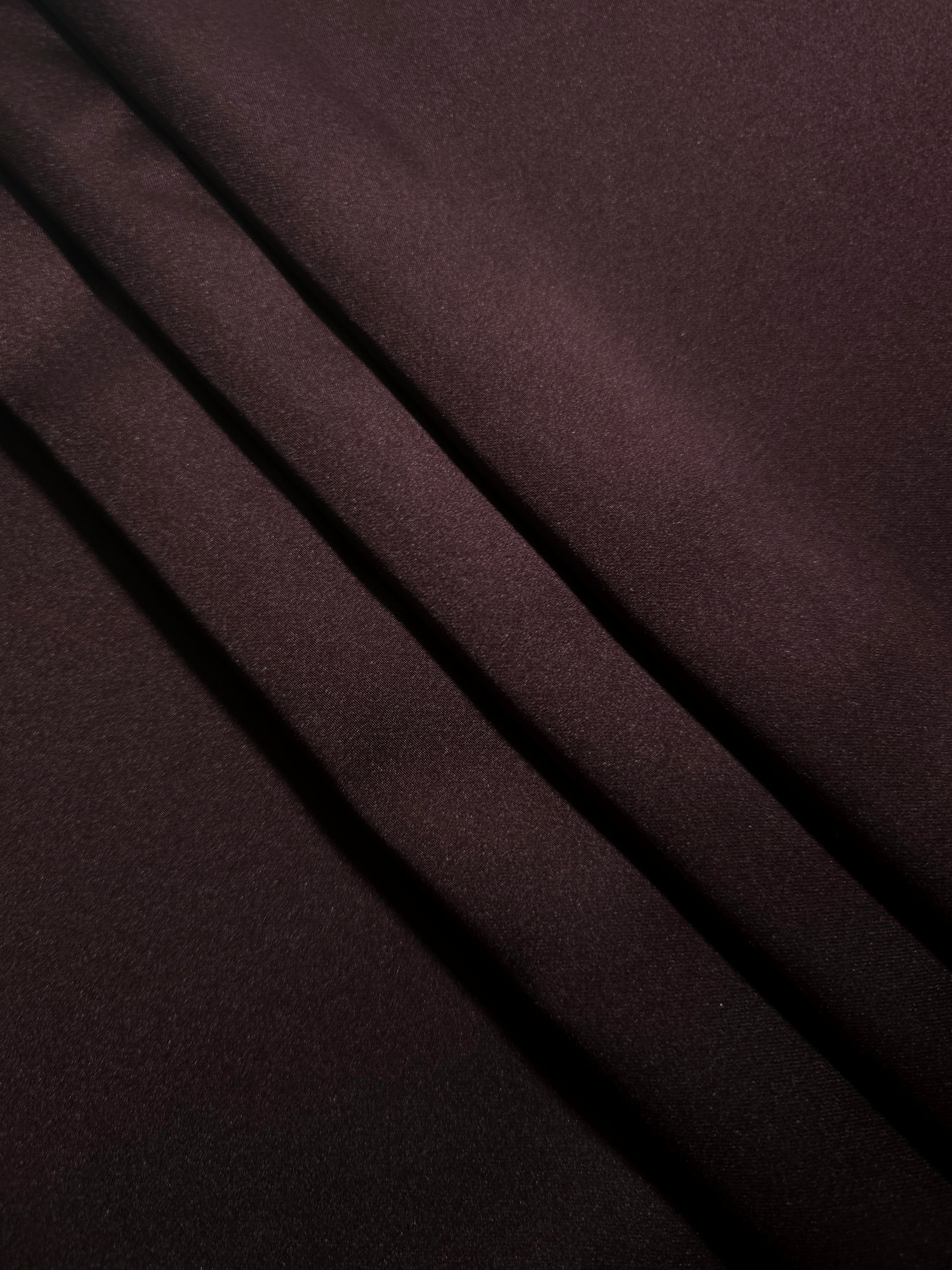 Softly folded Deep Purple silky satin shows a luxurious fall for bias-cut dresses, elegant pajama sets and sophisticated robes.
