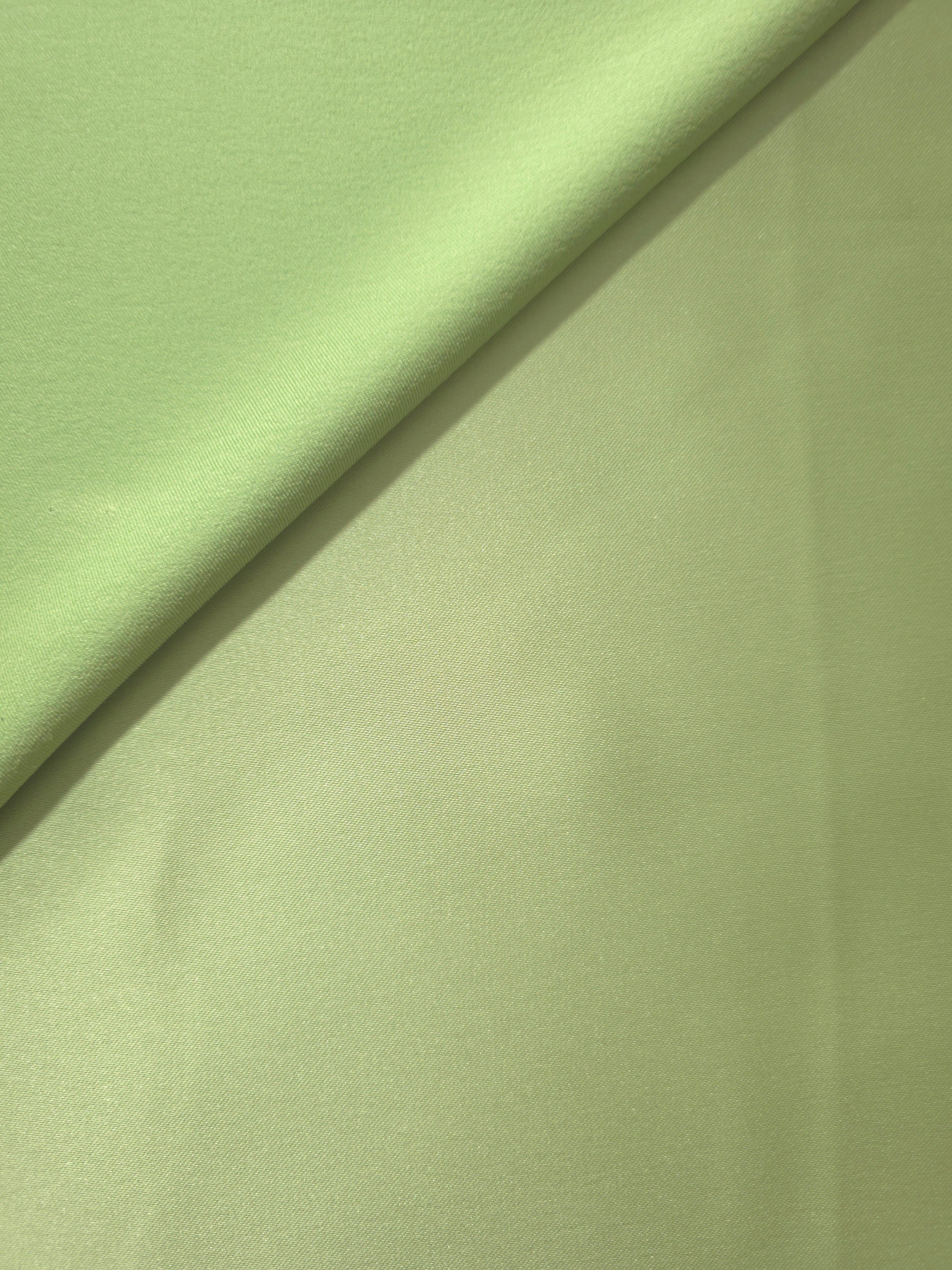 Mint Green satin in folded detail displays smooth shine and dimensional shadow for pleated skirts, bodice accents and modern occasionwear.