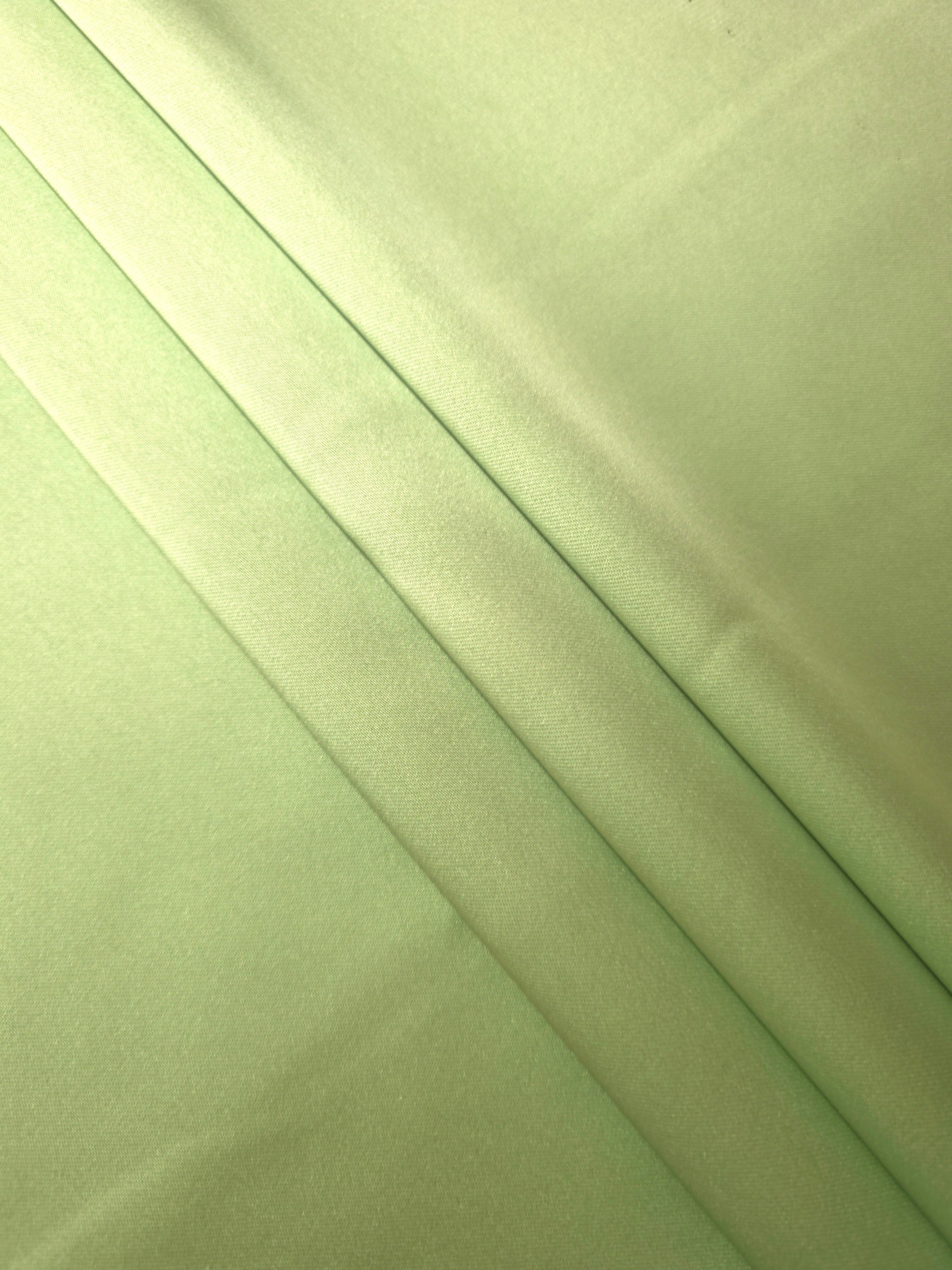 Softly folded Mint Green silky satin reveals a gentle fluid hand for slip dresses, relaxed blouses and lightweight robes.