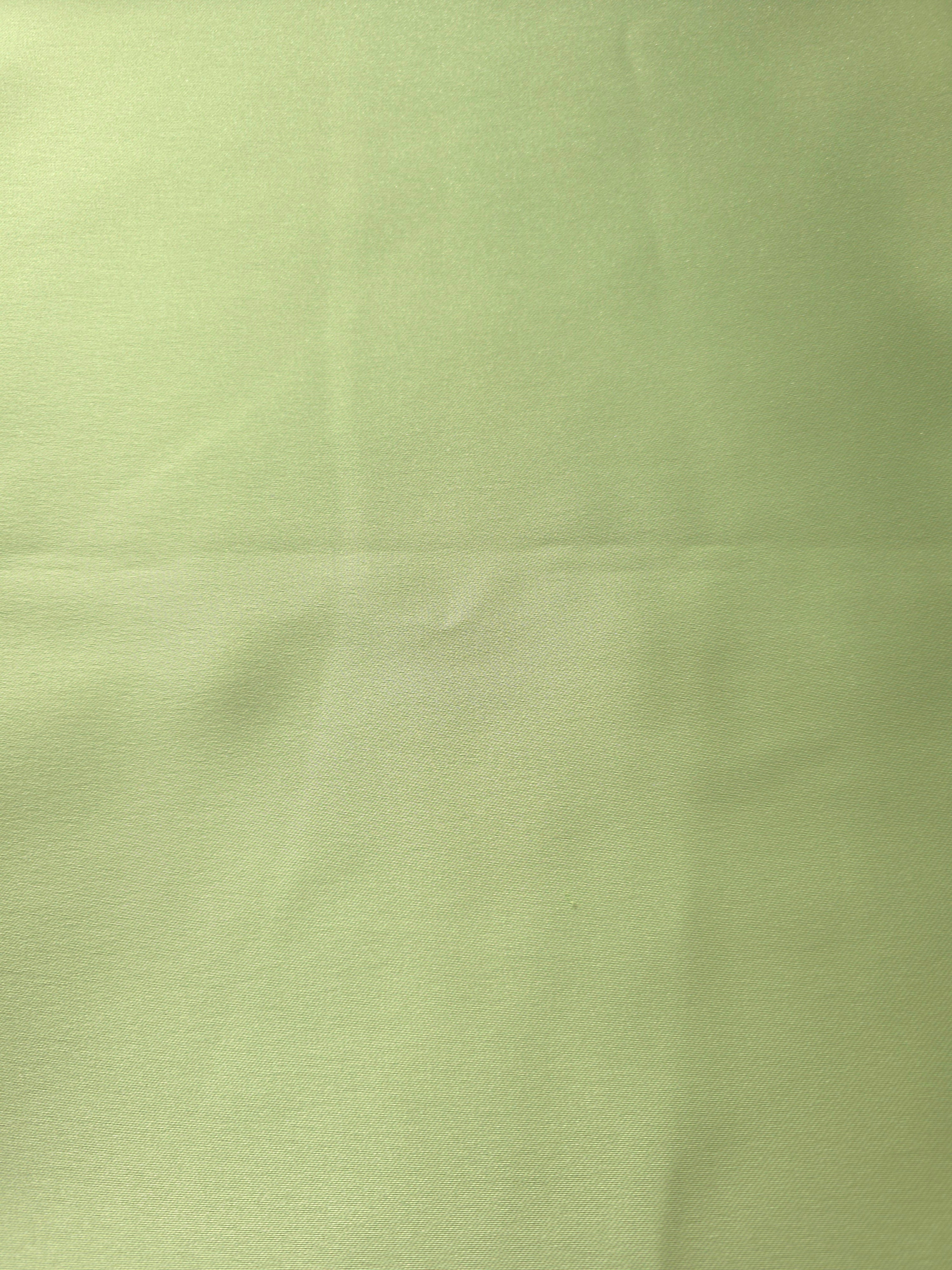 Close-up of Mint Green silky satin highlights its smooth reflective texture for camisoles, delicate tops and elegant garment linings.