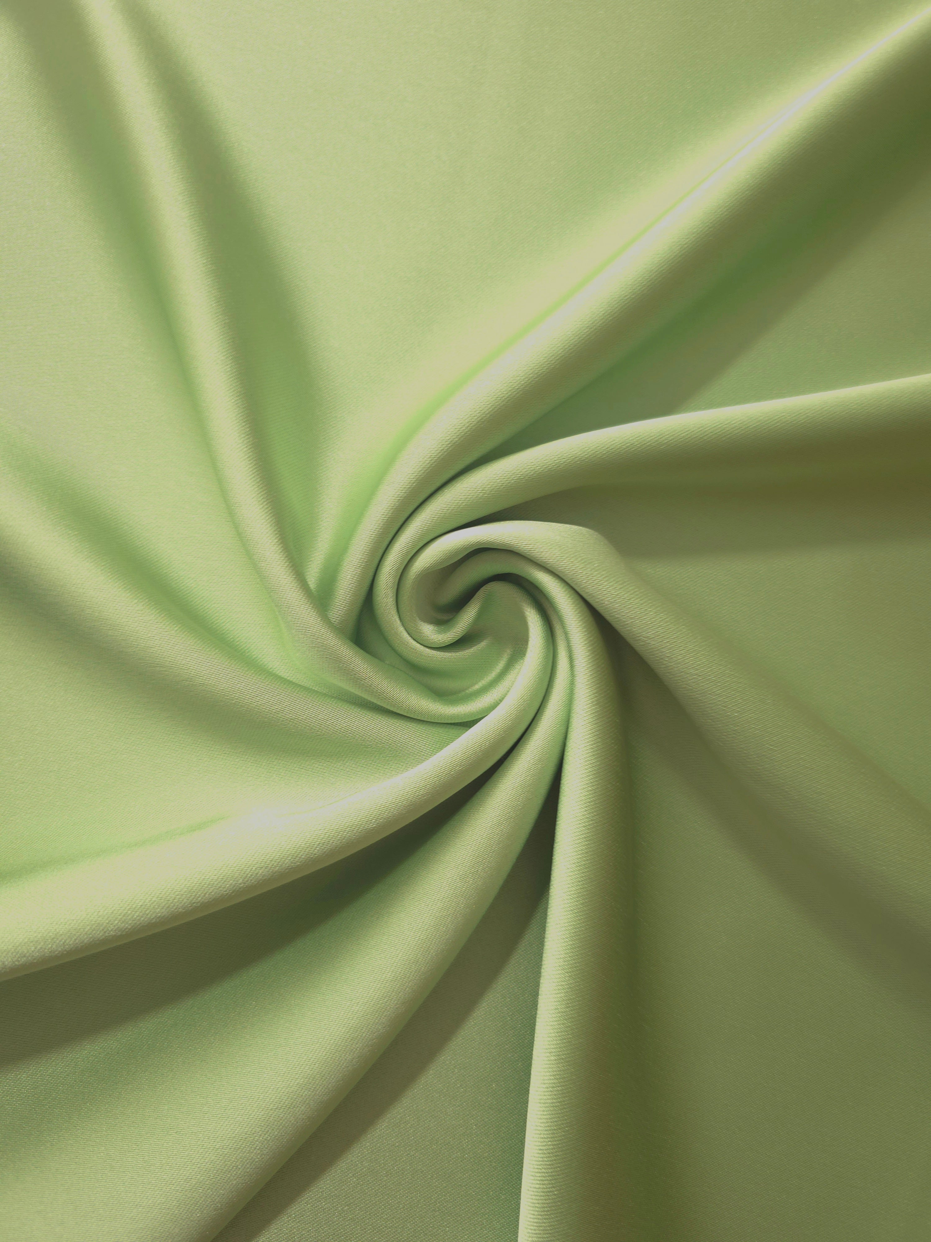Mint Green satin in a twist drape demonstrates airy movement and shifting sheen for prom dresses, draped necklines and flowing maxi skirts.