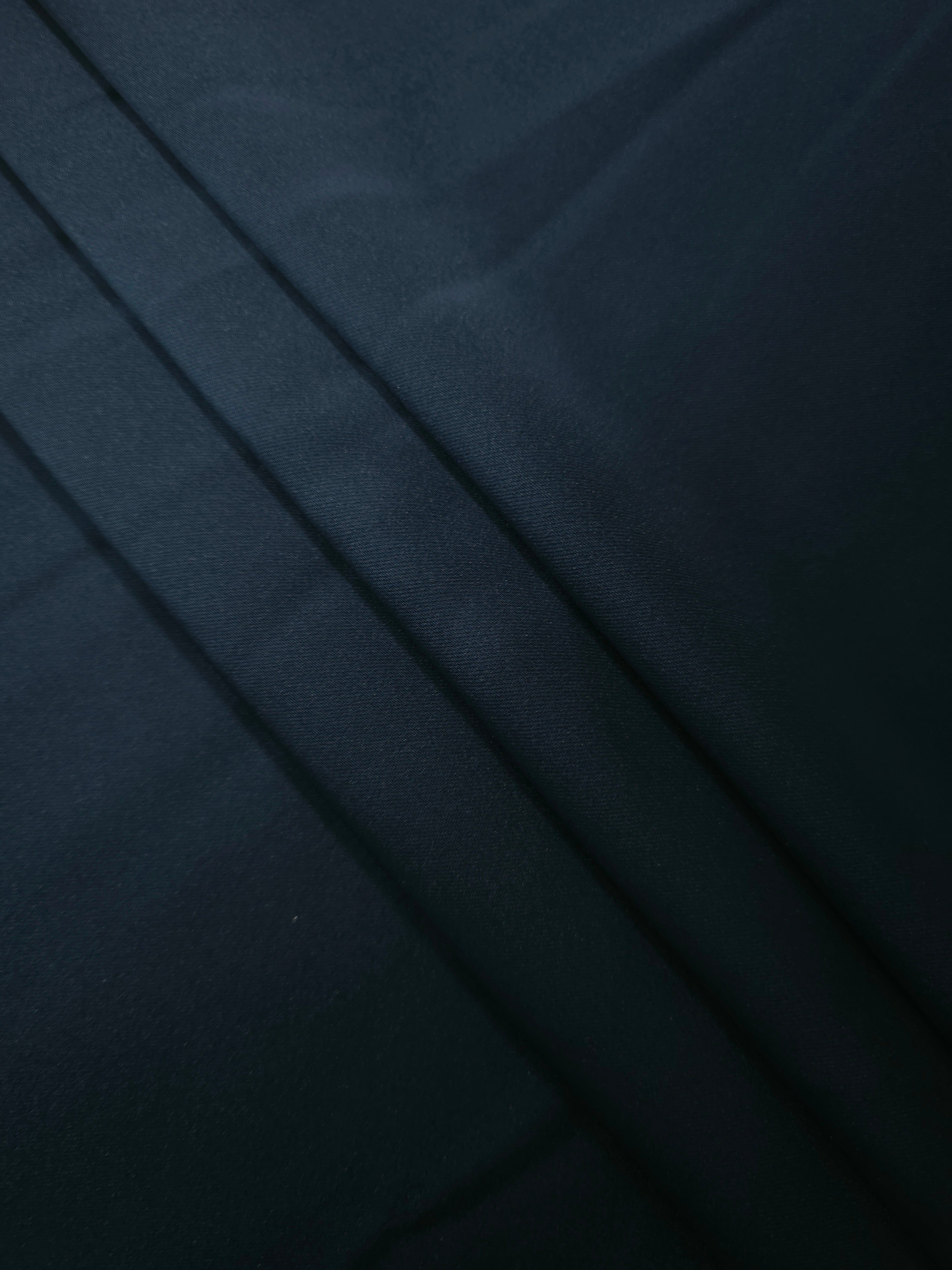 Soft folds of Royal Navy silky satin demonstrate a smooth fluid fall for slip dresses, pajama sets and refined robe designs.