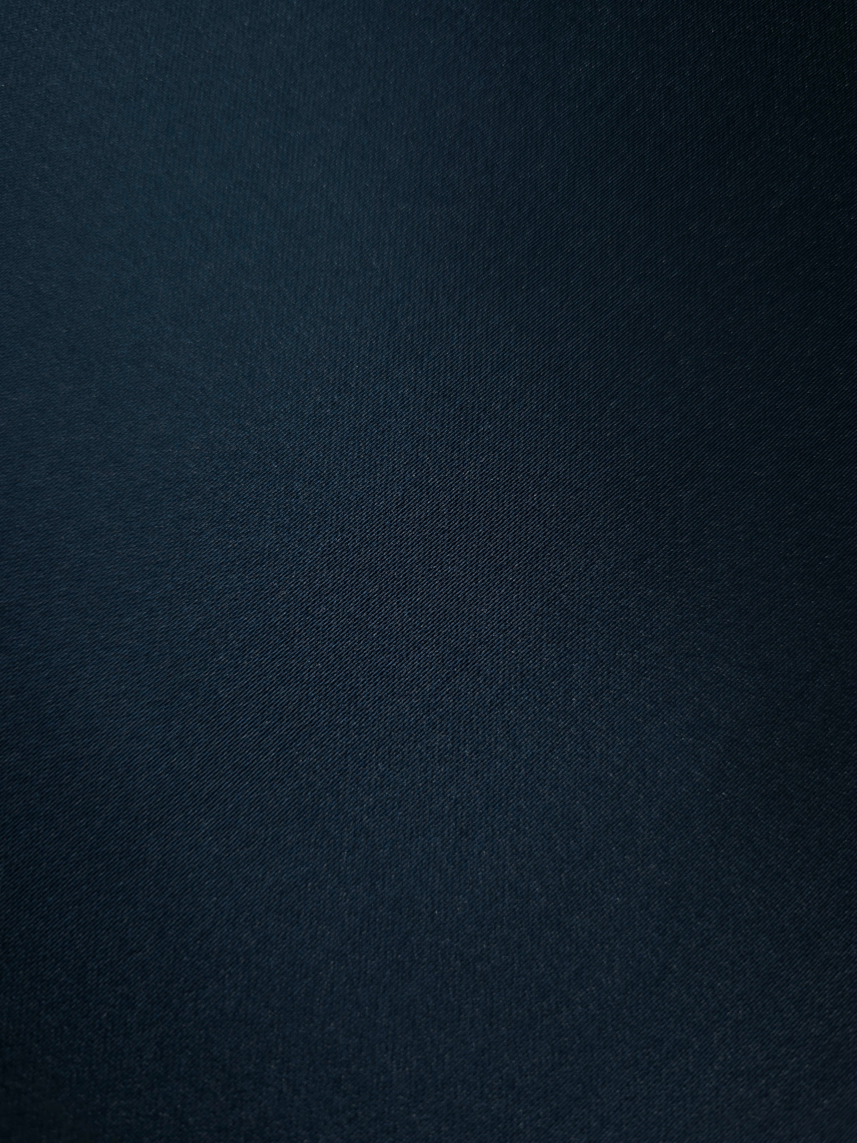 Close texture of Royal Navy silky satin highlights a sleek luminous face for blouse construction, premium linings and understated evening tops.