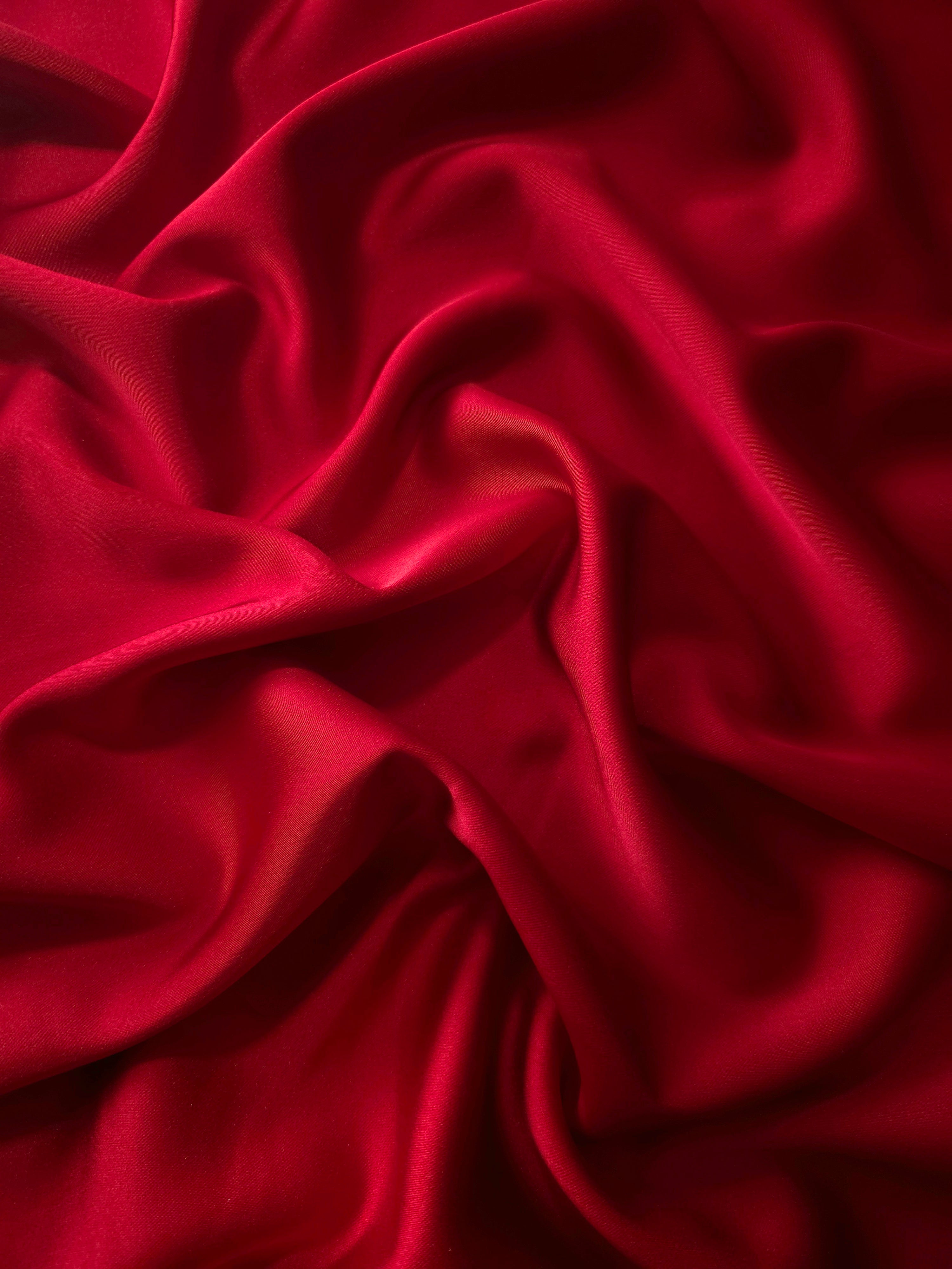 Ruby Red silky satin flows in a vivid drape, with high-impact sheen for evening gowns, celebration dresses and glamorous formal silhouettes.