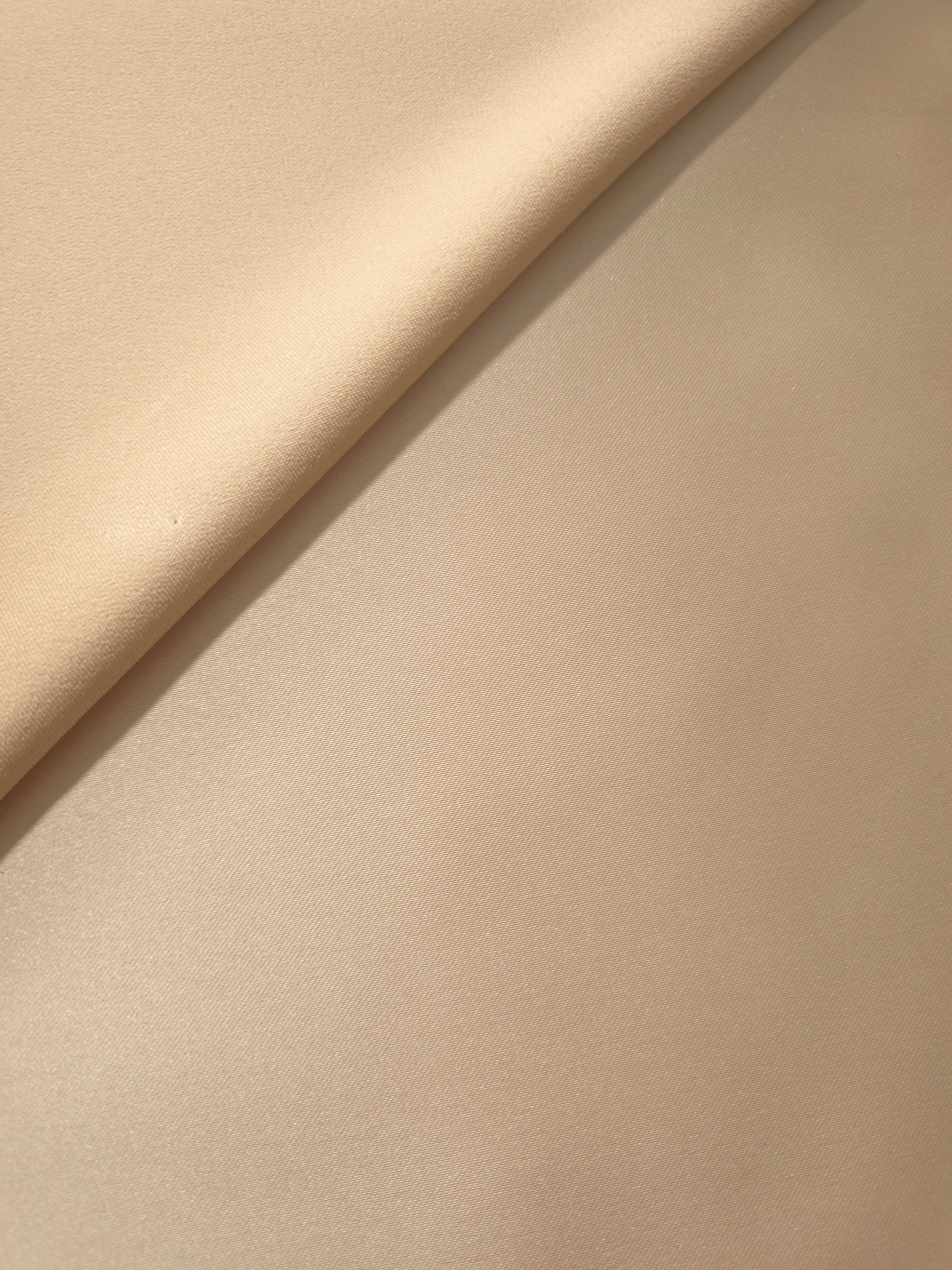 Folded Warm Nude satin highlights the contrast between smooth sheen and shadow, ideal for corset panels, cocktail skirts and occasionwear details.