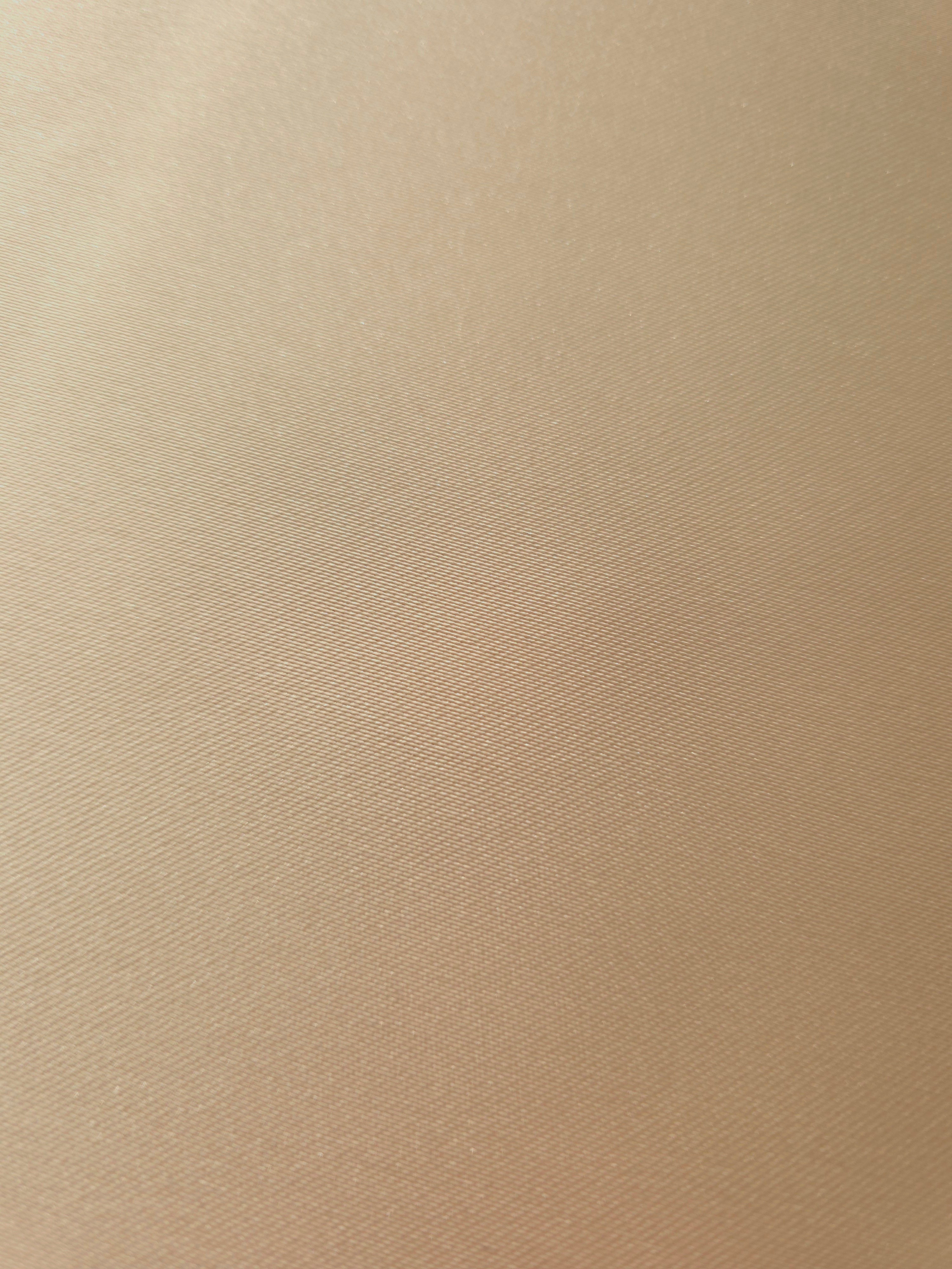 Detailed view of Warm Nude satin surface with refined luster for lingerie-inspired tops, scarf designs and polished garment accents.