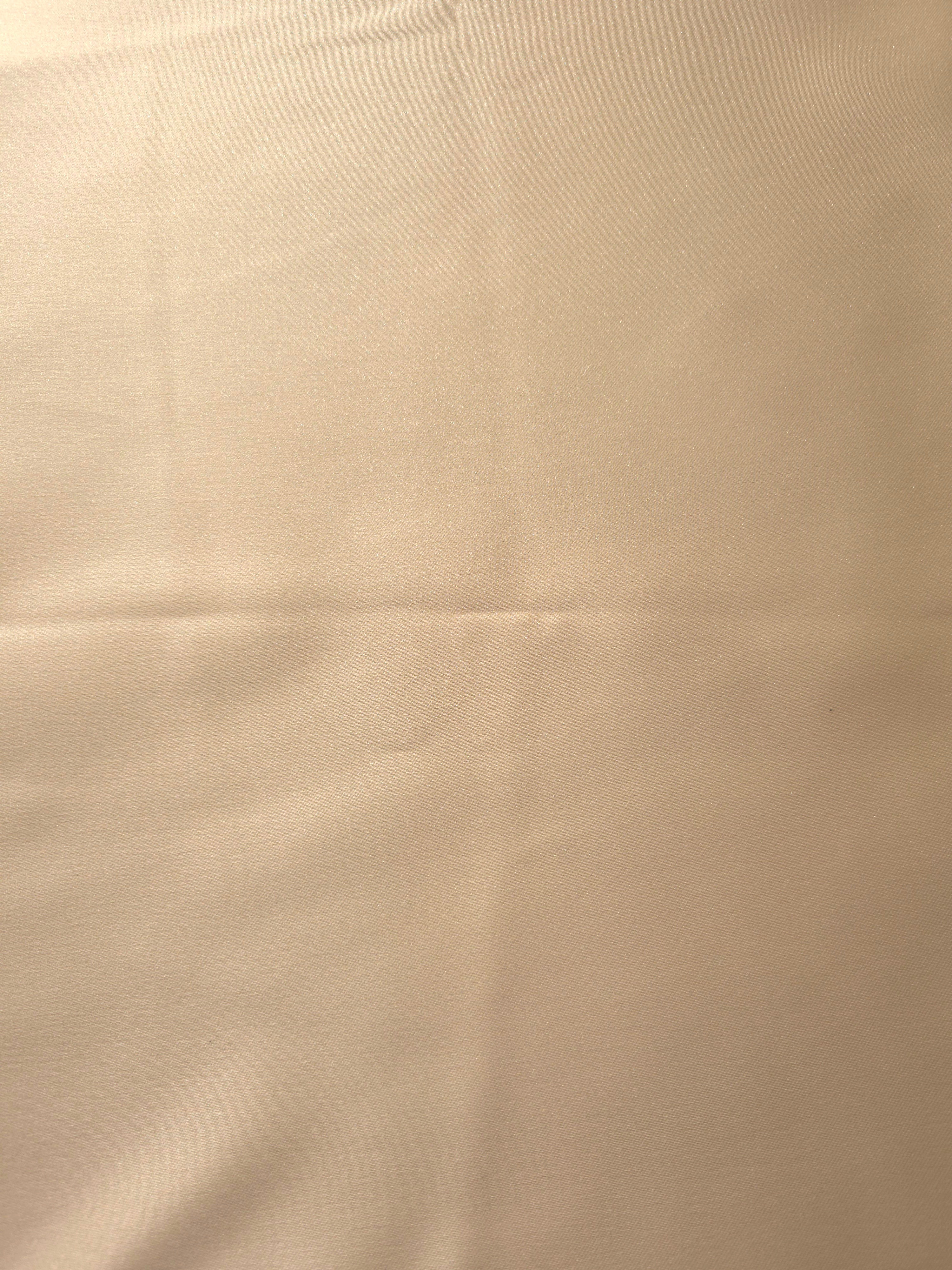 Close texture view of Warm Nude silky satin showing a sleek face and subtle reflection for linings, camisoles and elegant blouse construction.