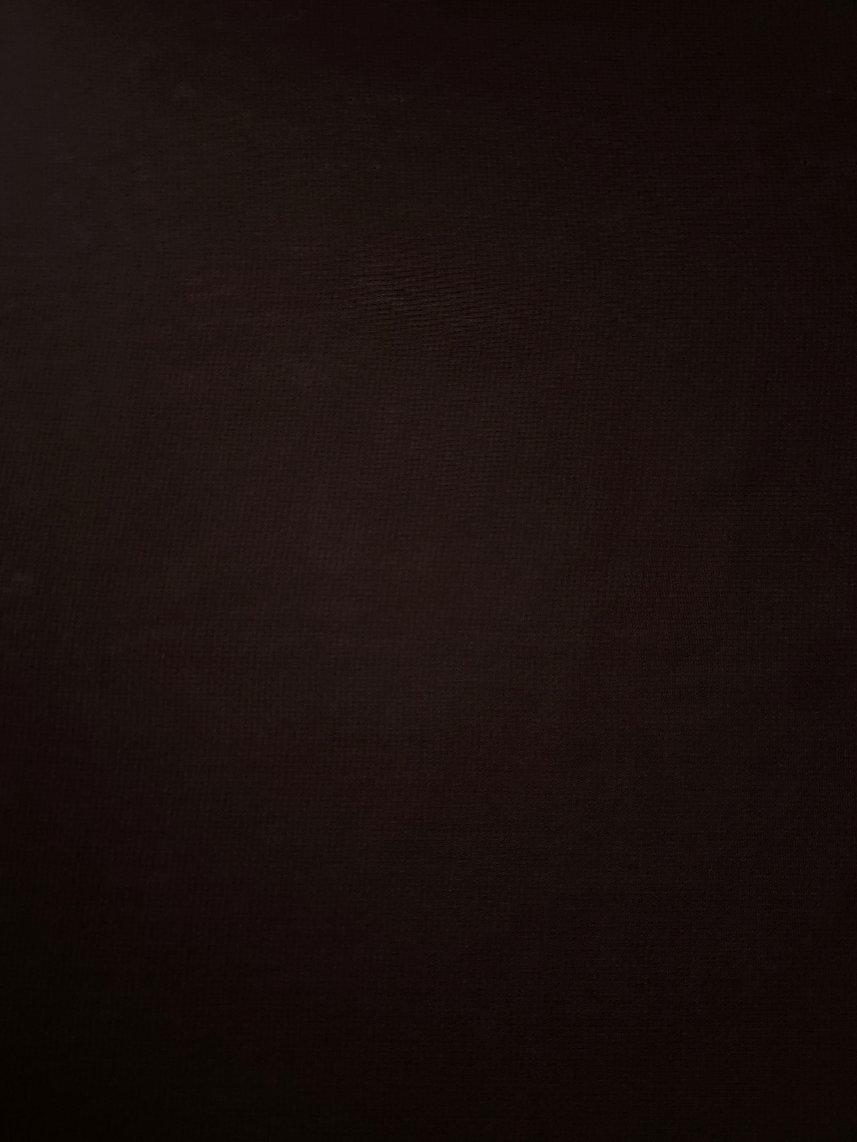 Texture view of Bitter Chocolate stretch chiffon, capturing the fine sheer character used for sheer sleeve panels, neckline ruffles and scarf accents.