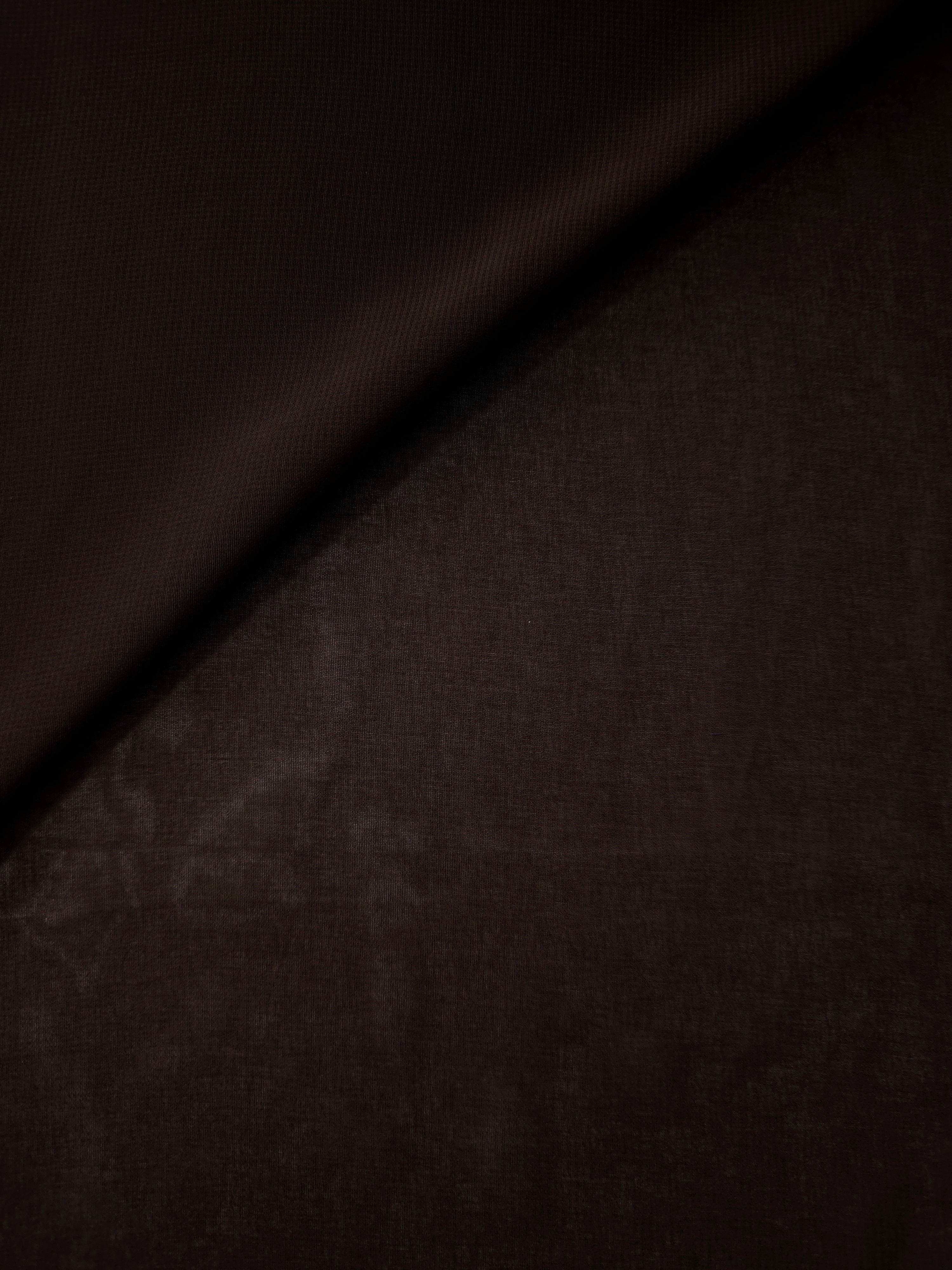 Bitter Chocolate silky stretch chiffon softly folded to display drape suited to flowing dresses, draped tops and soft lightweight wraps.
