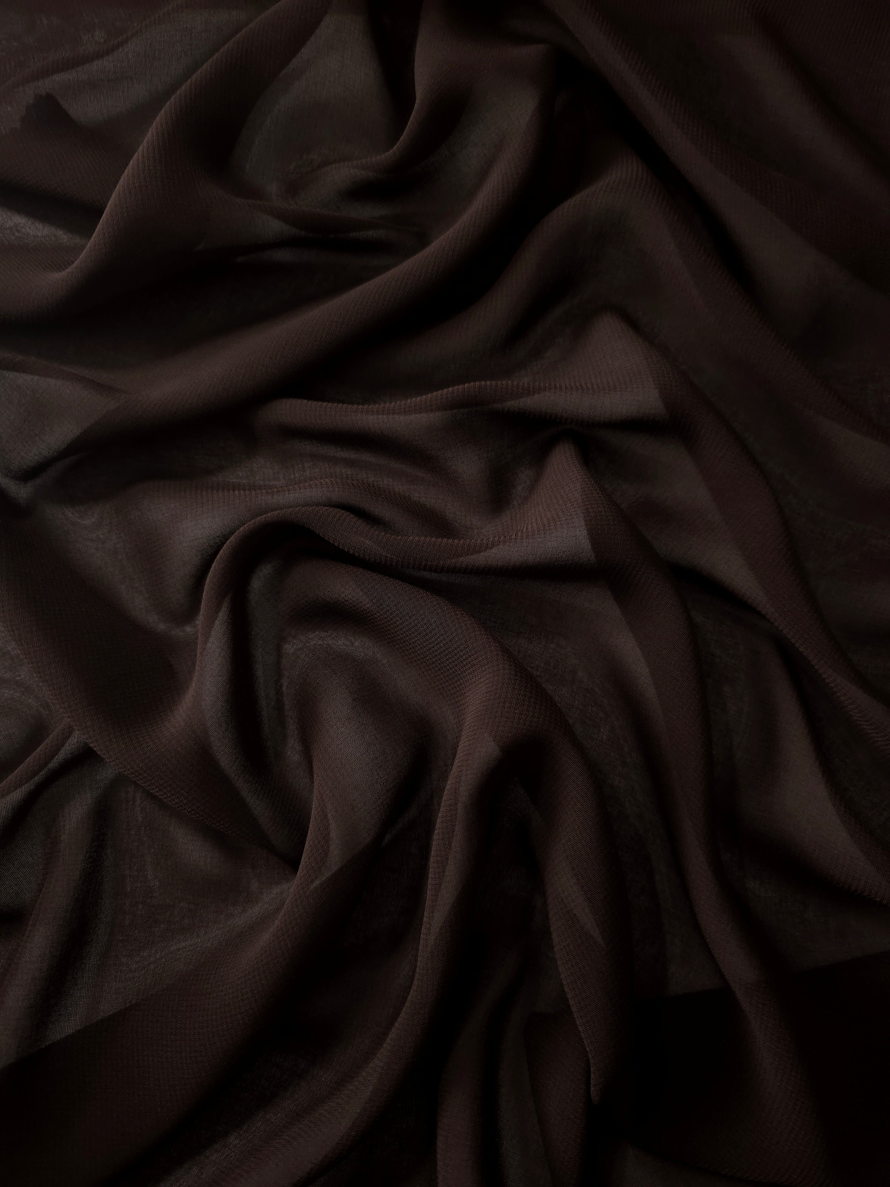 Bitter Chocolate silky chiffon stretch fabric in cascading folds, showing fluidity for formal skirts, evening gowns and layered dress panels.