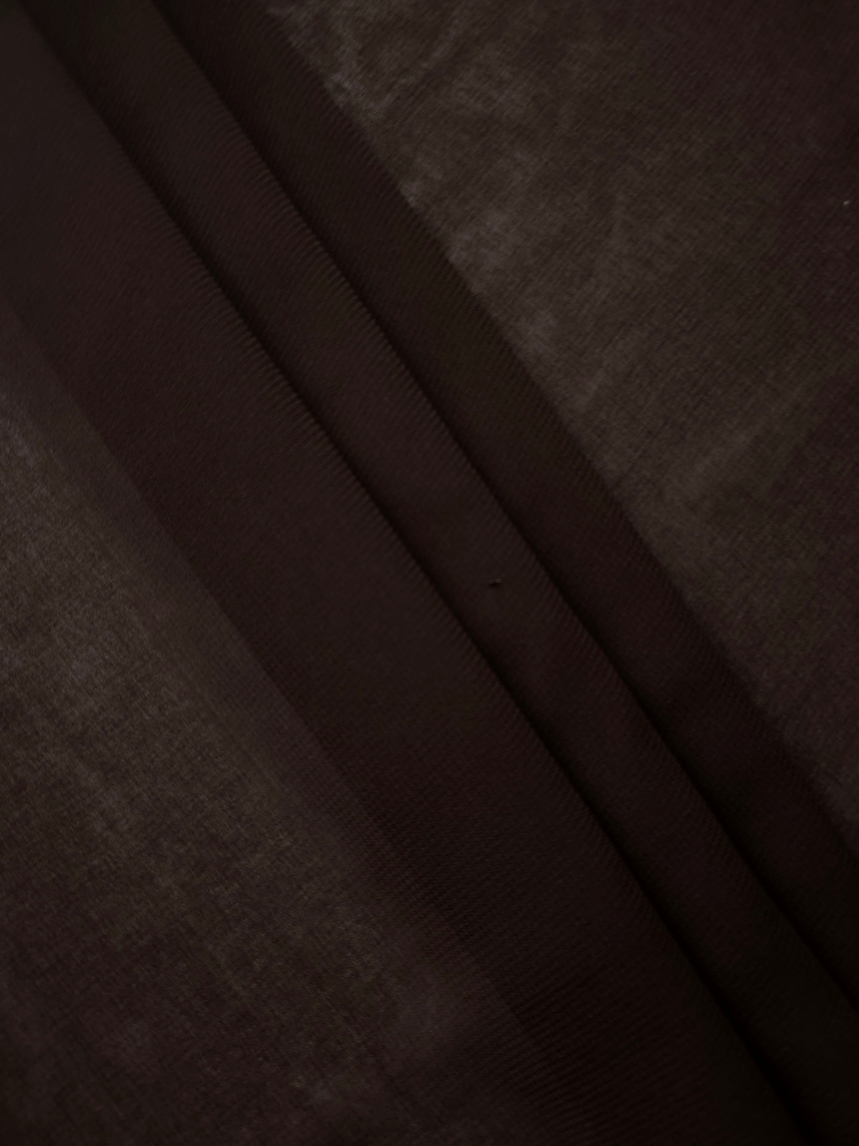 Bitter Chocolate stretch chiffon in overlapping folds, showing dimensional drape for tiered skirts, modest layers and fluid eveningwear.