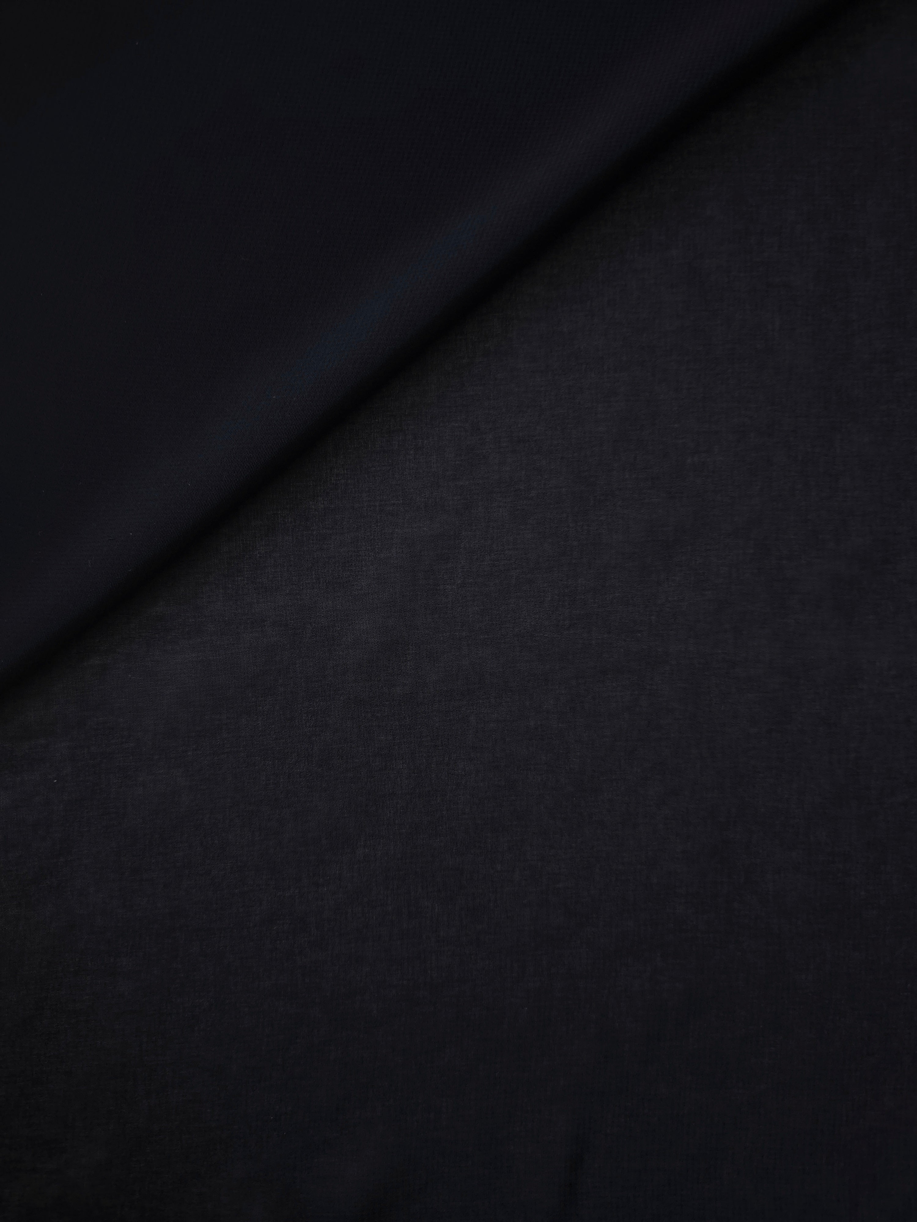 Softly folded Blackened Navy silky chiffon stretch fabric, demonstrating graceful flow for prom dresses, draped tops and lightweight wraps.