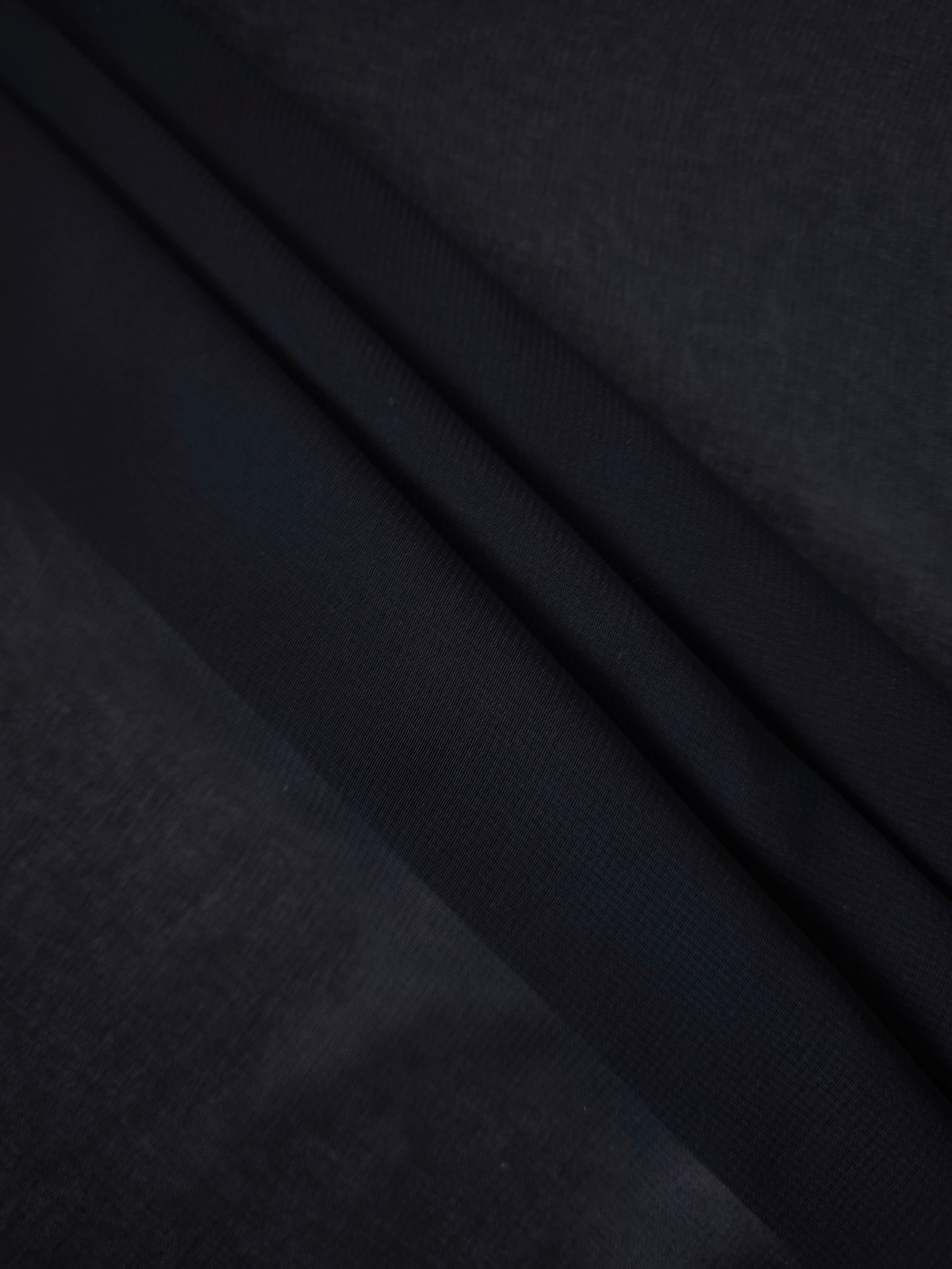 Blackened Navy silky stretch chiffon stacked in soft layers, revealing airy volume for tiered skirts, cape overlays and dimensional nightwear looks.