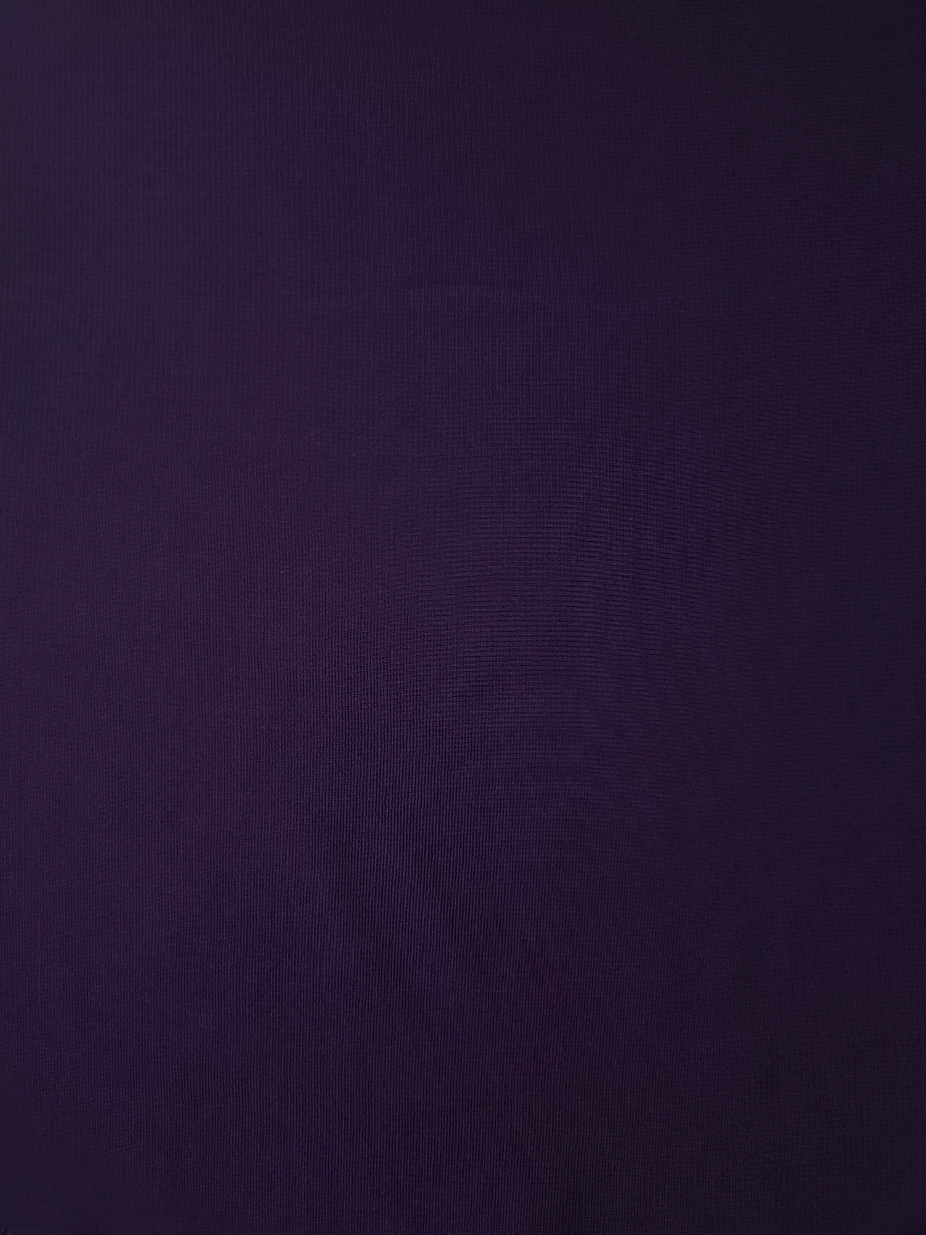 Deep Aubergine silky stretch chiffon shown flat, highlighting its lightweight sheer surface for formal blouses, evening skirts and rich-toned overlays.