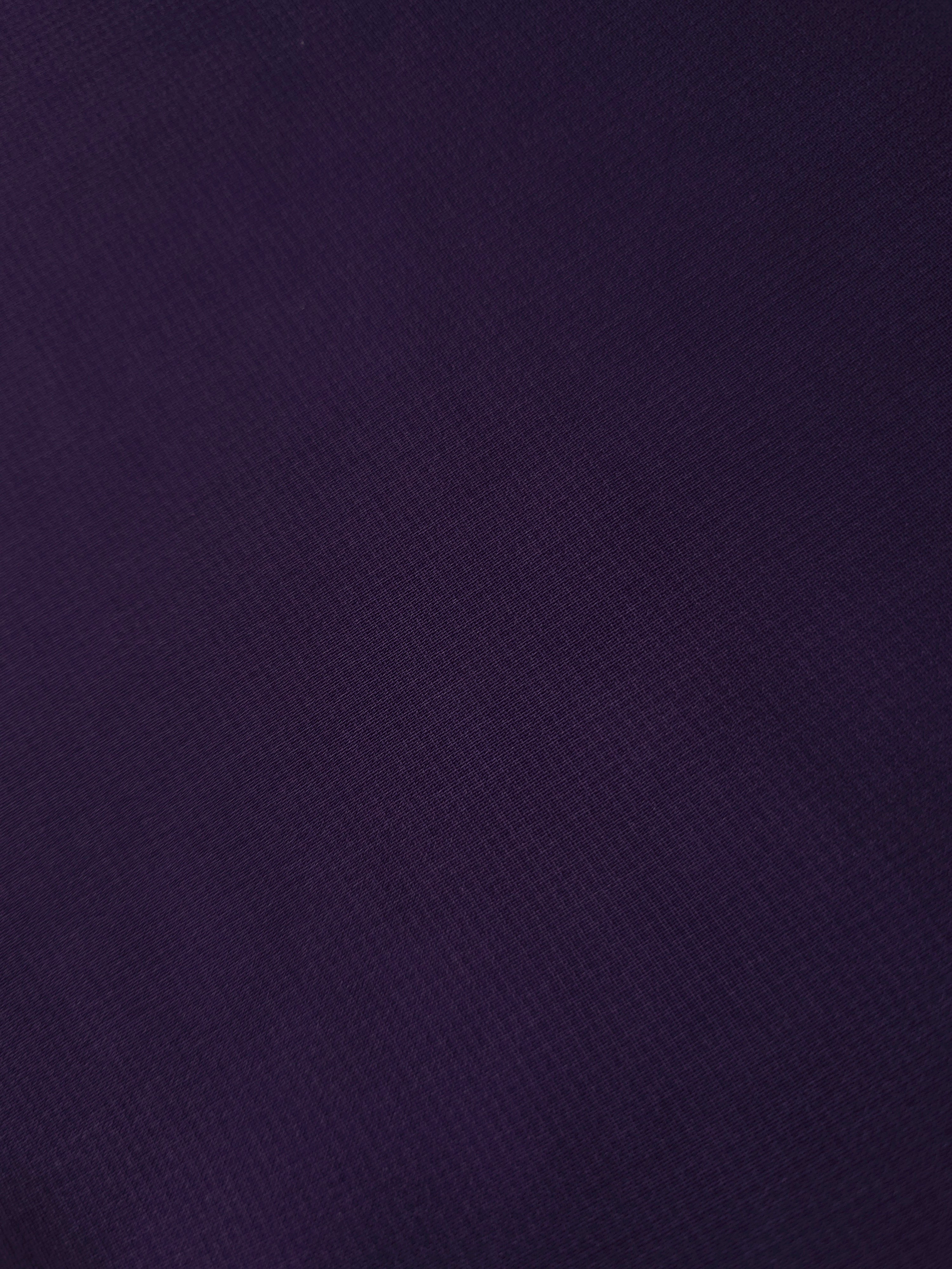 Close-up of Deep Aubergine stretch chiffon revealing fine texture and translucency for sheer sleeves, ruffle trims and refined blouse inserts.