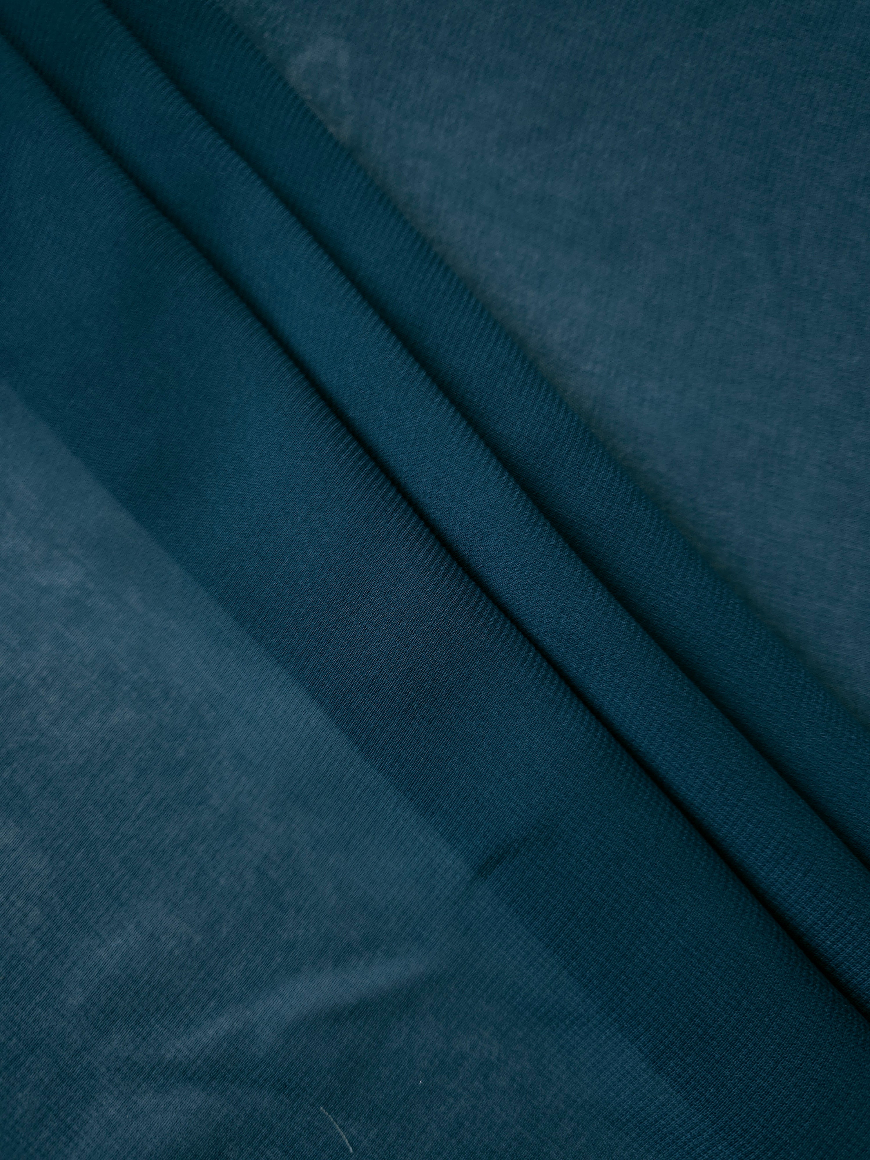 Swirled Deep Petrol Teal silky stretch chiffon shows soft motion and fluid drape for wraps, gathered panels and fluid formal dress details.