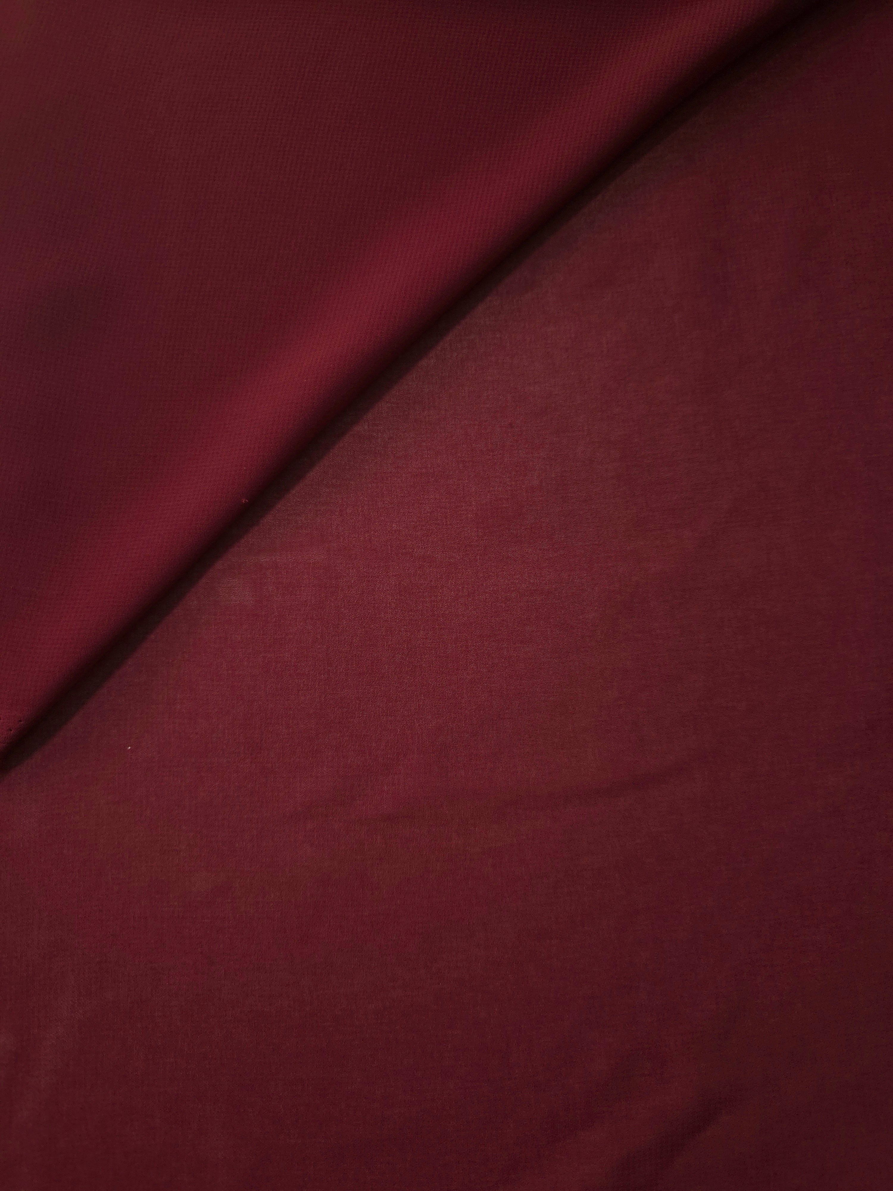 Gentle fold of Garnet Wine stretch chiffon showing its supple fall and airy body for cocktail dresses, soft scarves and draped occasion tops.