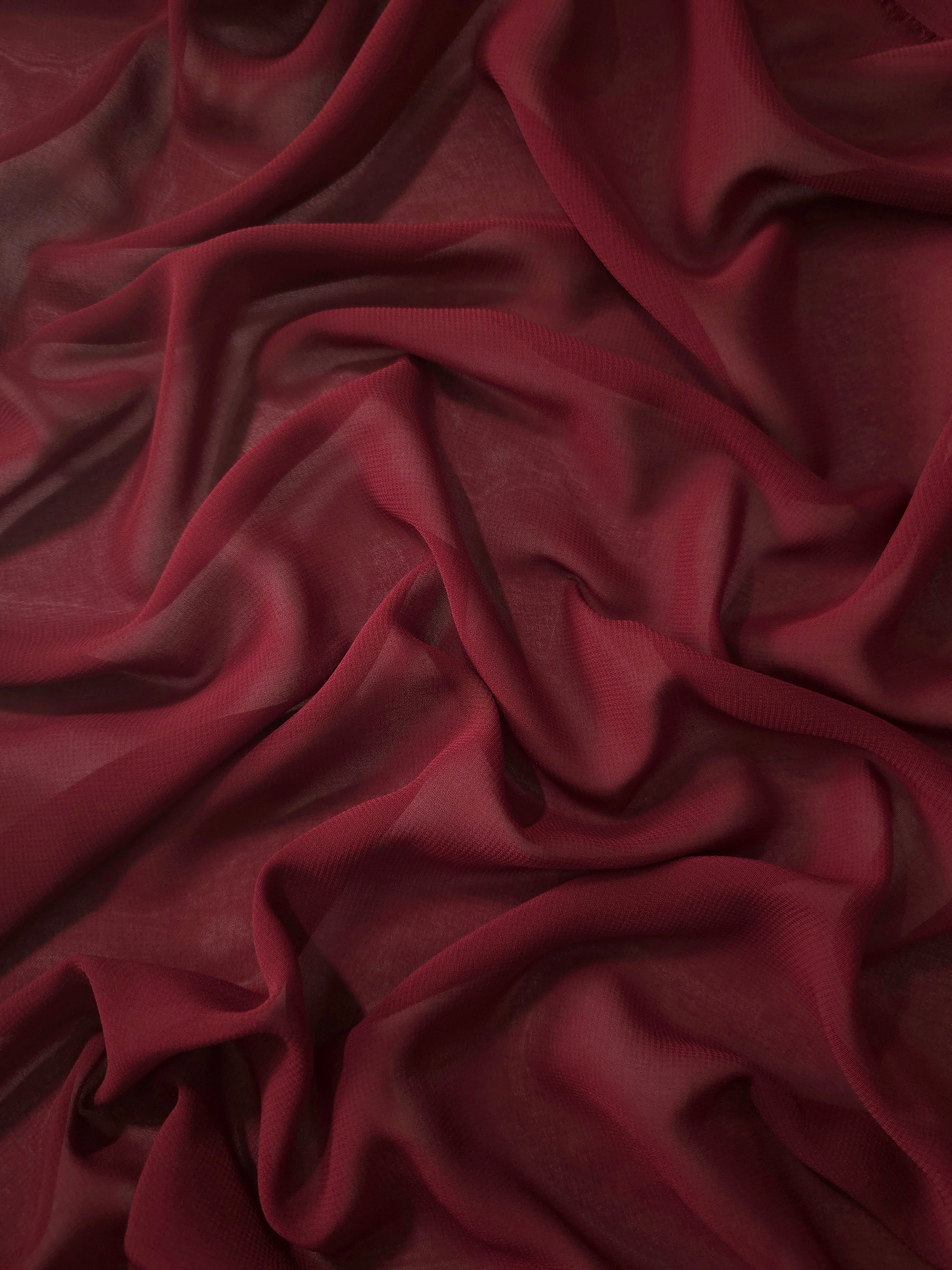 Flowing folds of Garnet Wine stretch chiffon highlight its elegant drape for formal gowns, flowing maxi skirts and layered dress panels.