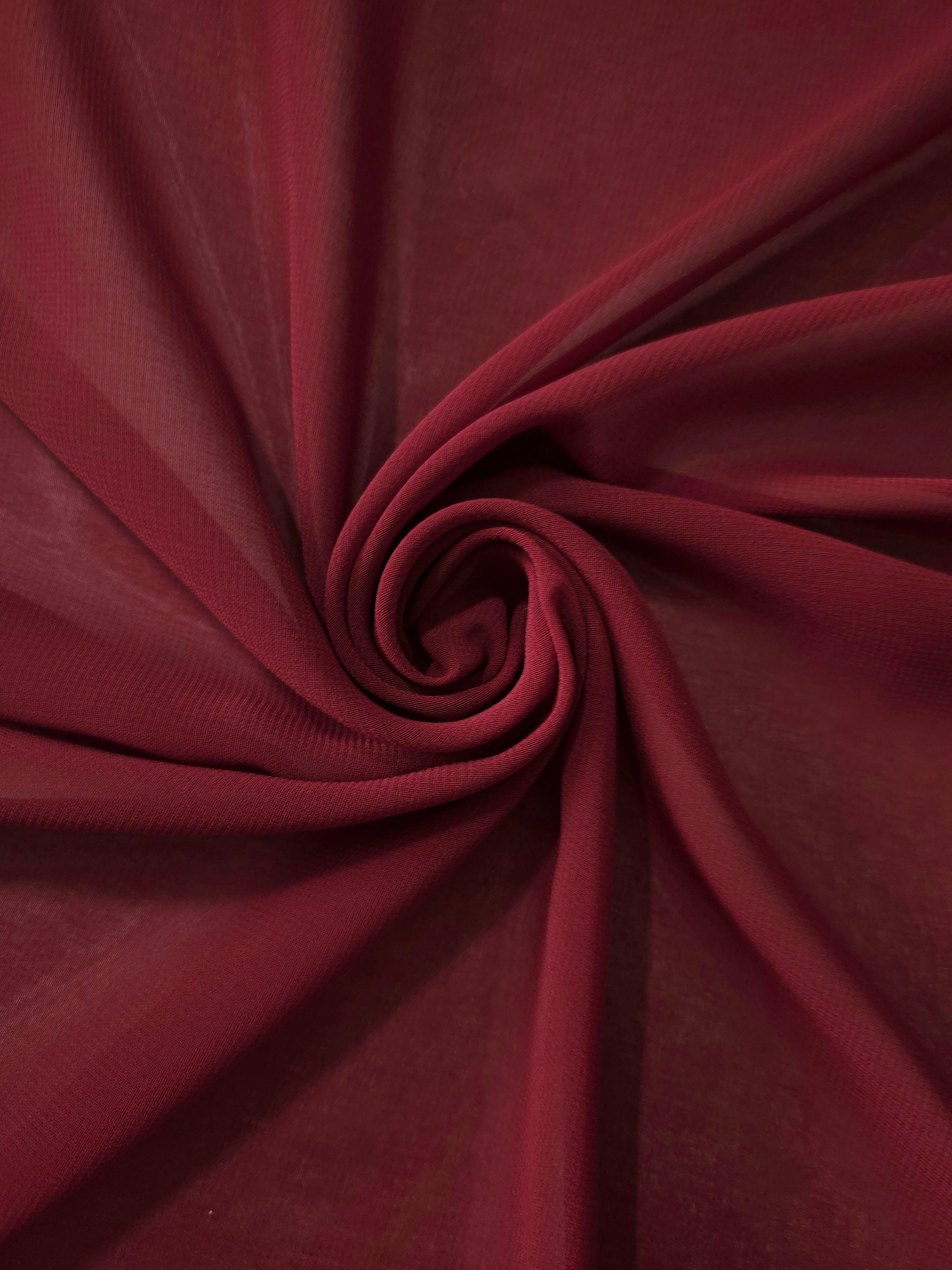 Circular drape of Garnet Wine stretch chiffon highlights graceful flow for shawls, gathered overlays and romantic evening details.