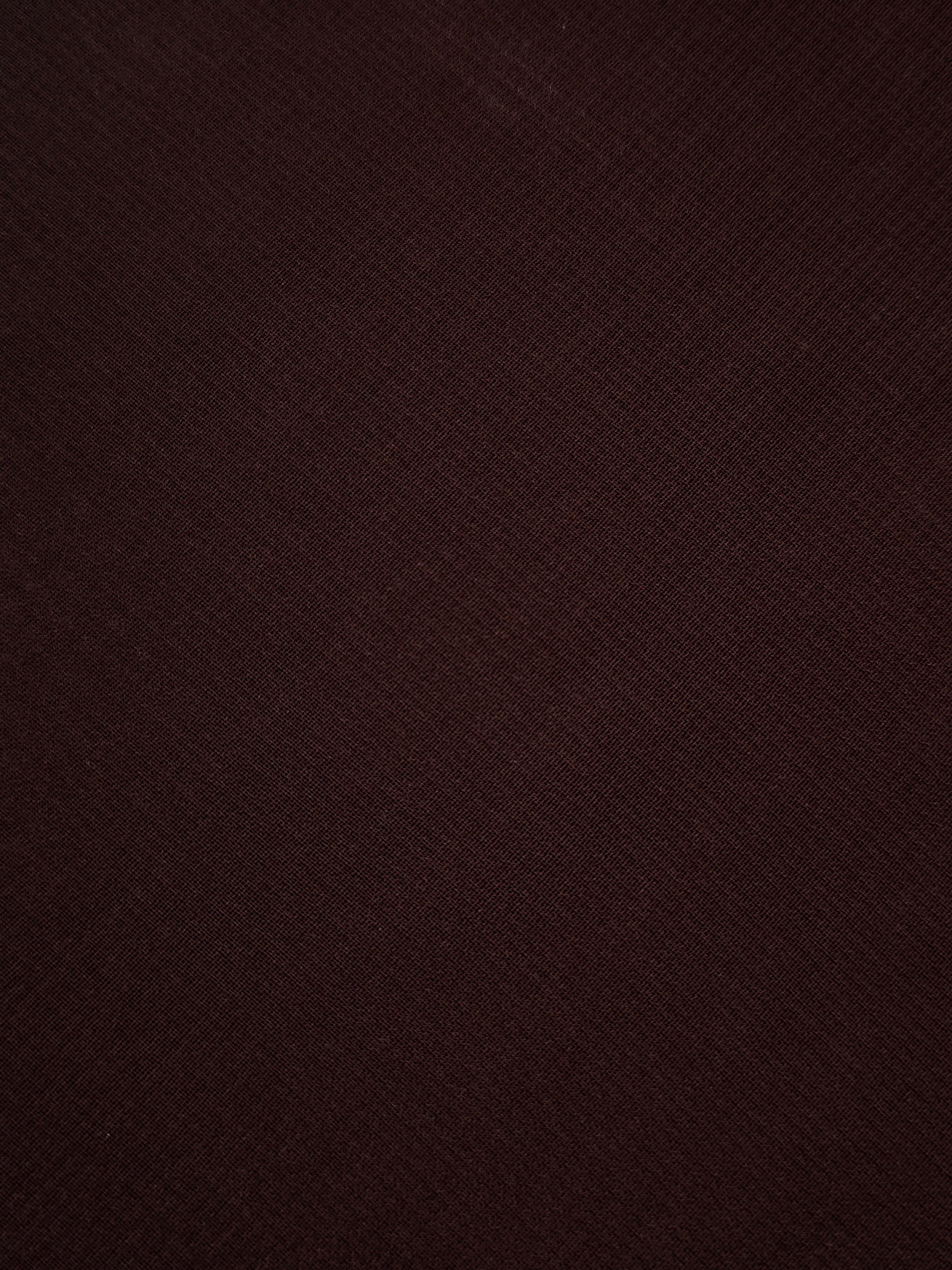 Mahogany Brown silky stretch chiffon shown flat, highlighting its lightweight sheer surface for autumn eveningwear, blouses and deep brown skirt overlays.