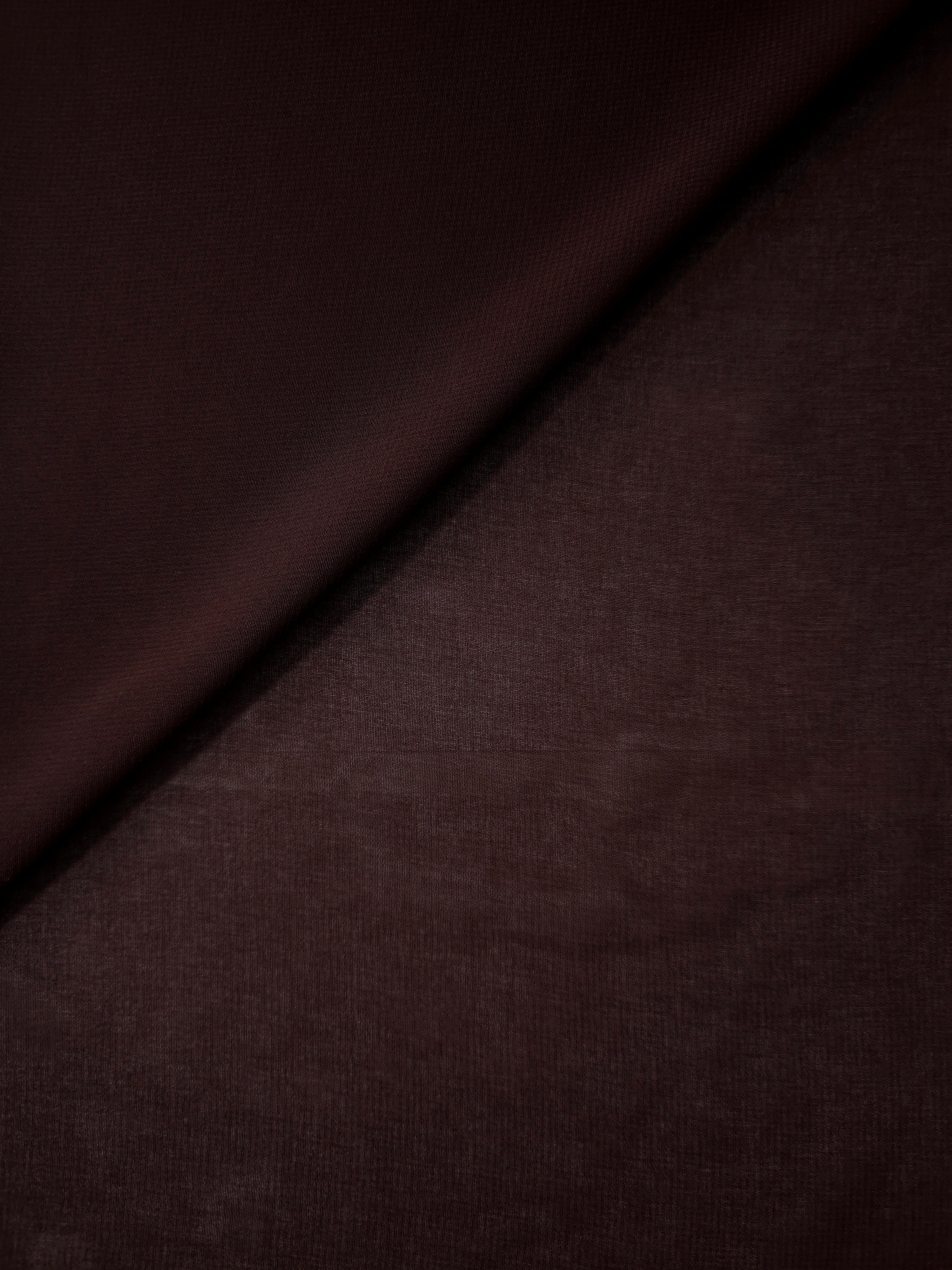 Mahogany Brown stretch chiffon in a soft fold, showing fluid drape and light movement for draped dresses, soft tops and lightweight scarves.