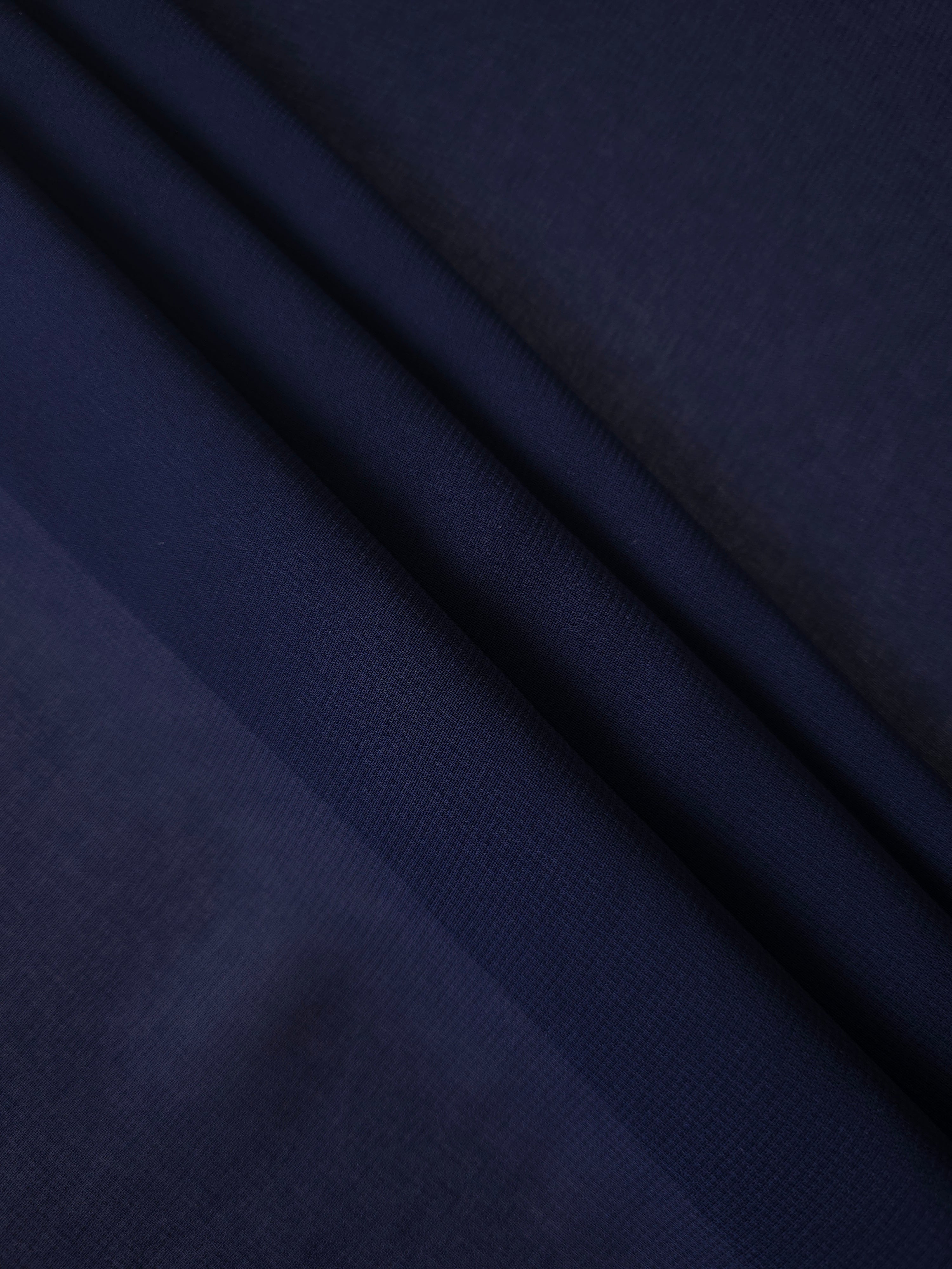 Midnight Navy silky stretch chiffon stacked in soft layers, revealing airy volume for tiered occasion skirts, cape overlays and layered eveningwear.
